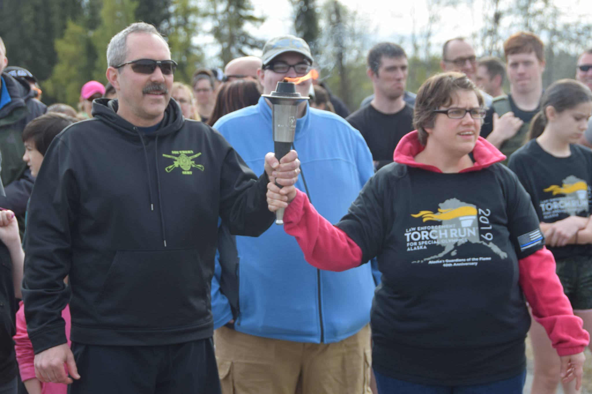 Local athletes and volunteers line up outside the Soldotna Regional Sports Complex to start the annual Special Olympics Torch Run in Soldotna, Alaska on May 18, 2019. (Photo by Brian Mazurek/Peninsula Clarion)