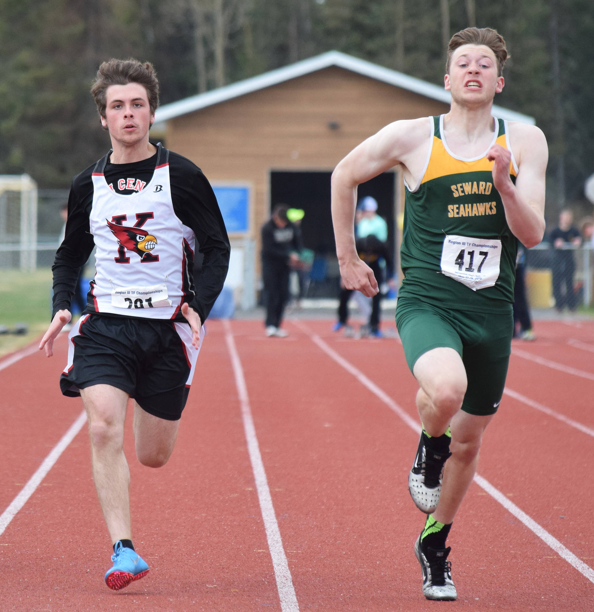 Kenai Central’s Elias Machen-Gray (left) and Seward’s Connor Spanos race in the Class 3A boys 100-meter final Saturday at the Region III Track and Field championships in Soldotna. (Photo by Joey Klecka/Peninsula Clarion)