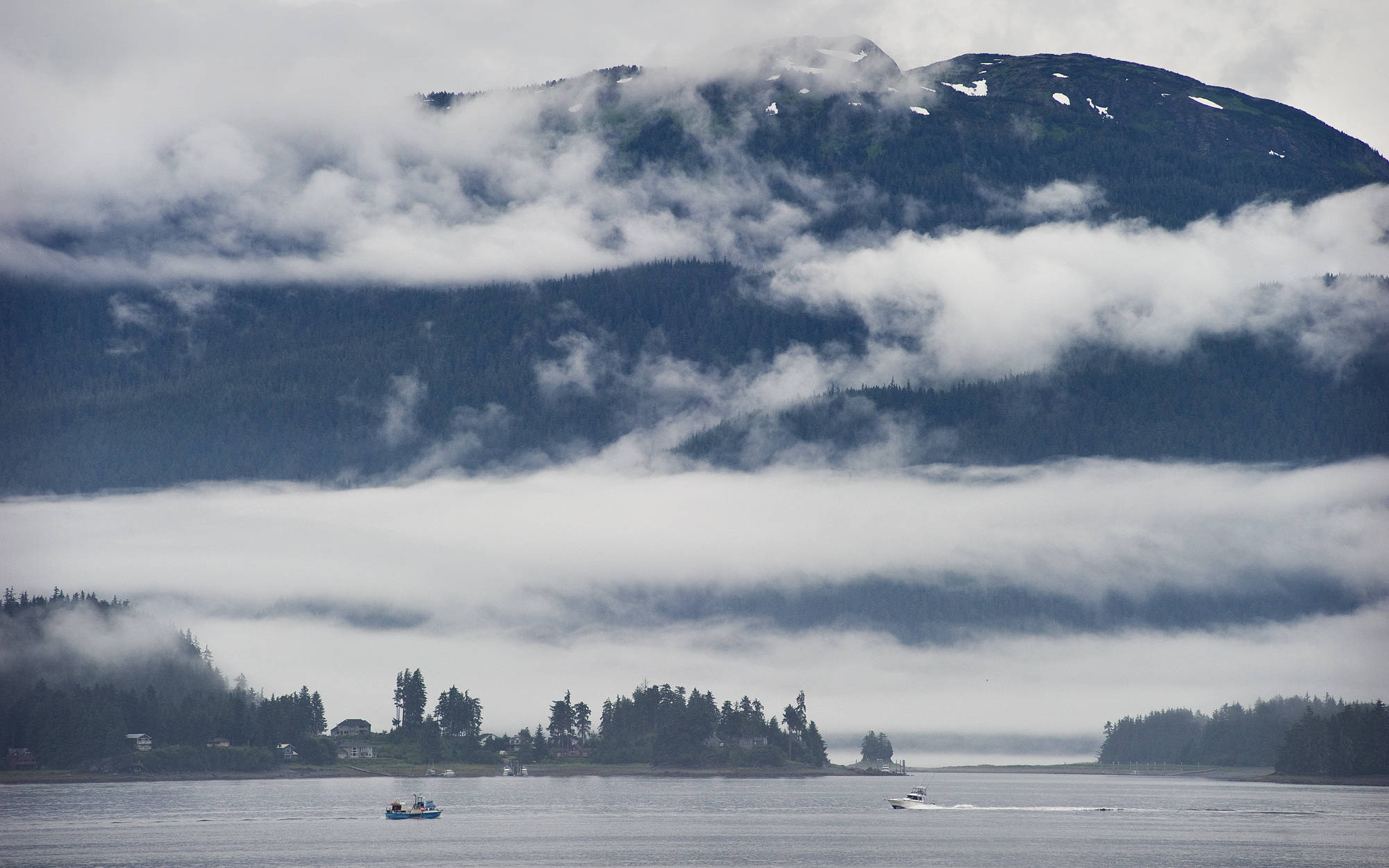 Clouds and mist hang over Fritz Cove and Douglas Island. (Michael Penn | Juneau Empire File)