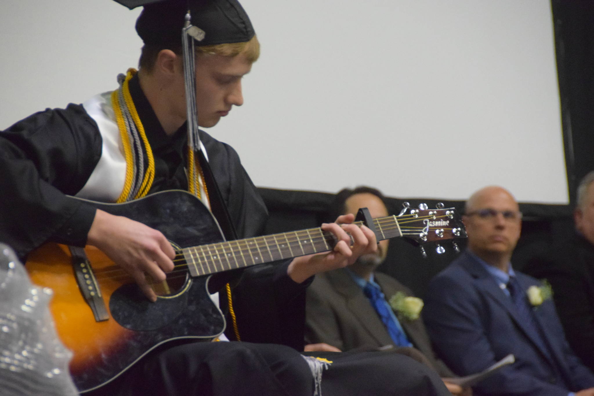 Gabriel Smith performs “Classical Gas” by Mason Williams during the 2019 Nikiski High School graduation in Nikiski, Alaska on May 20, 2019. (Photo by Brian Mazurek/Peninsula Clarion)