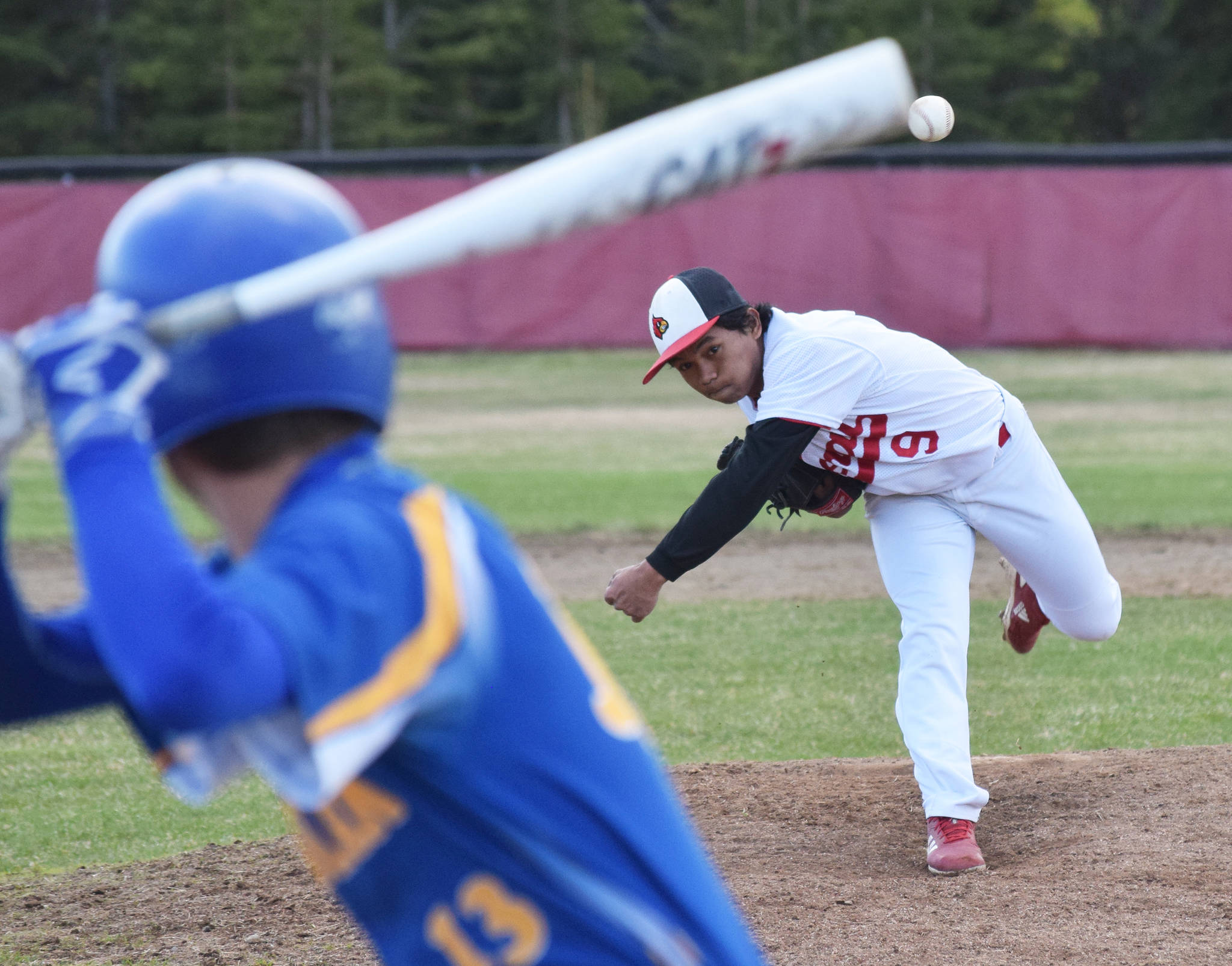 Kenai’s Harold Ochea offers up a pitch to Kodiak batter Paul Winegart Thursday, May 16, 2019, at the Kenai Little League Fields in Kenai, Alaska. (Photo by Joey Klecka/Peninsula Clarion)