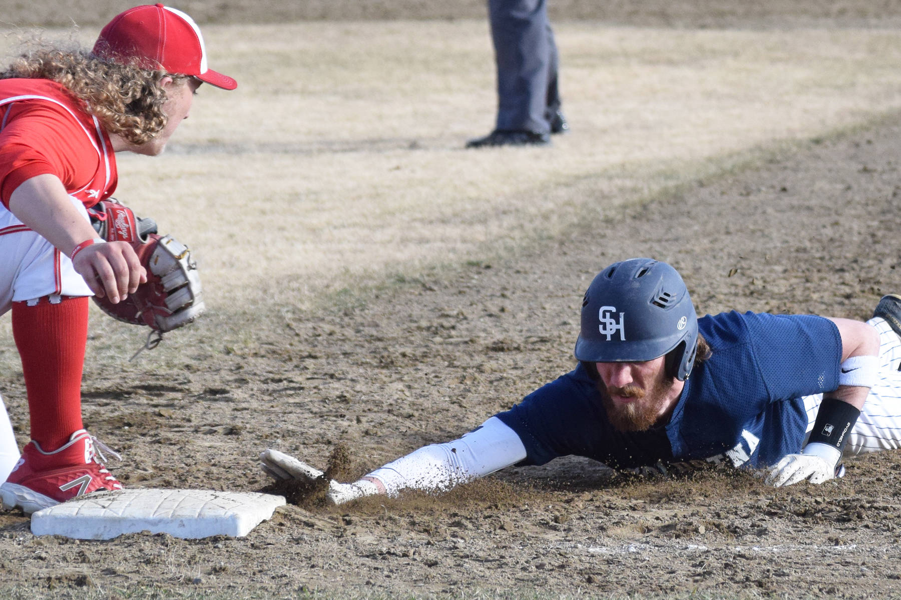 Soldotna’s David Michael tags first base ahead of Wasilla’s Clancy O’Donnell in a Southcentral Conference contest Thursday, May 2, 2019, at the Soldotna Baseball Fields. (Photo by Joey Klecka/Peninsula Clarion)