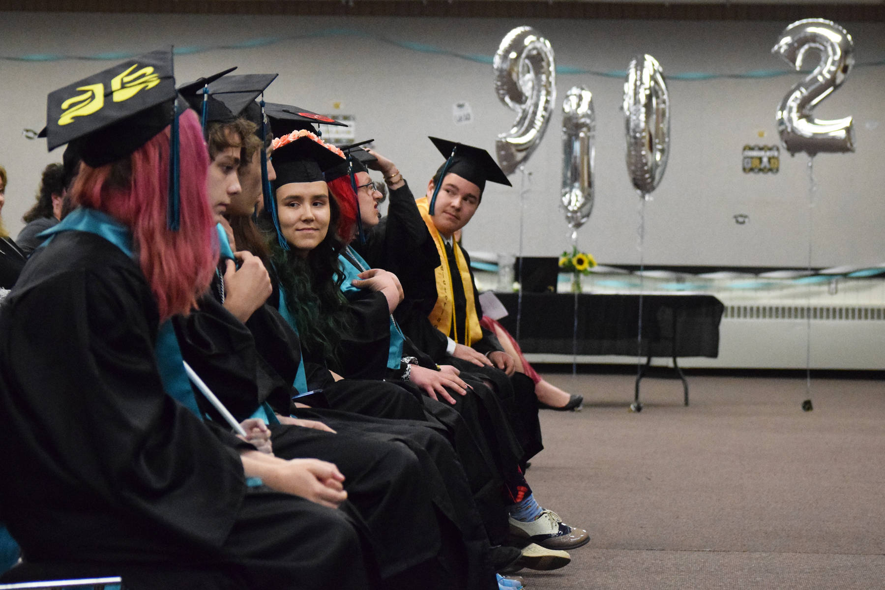 The River City Academy class of 2019 awaits the walking ceremony Tuesday, May 21, 2019, at the Soldotna Regional Sports Complex in Soldotna, Alaska. (Photo by Joey Klecka/Peninsula Clarion)