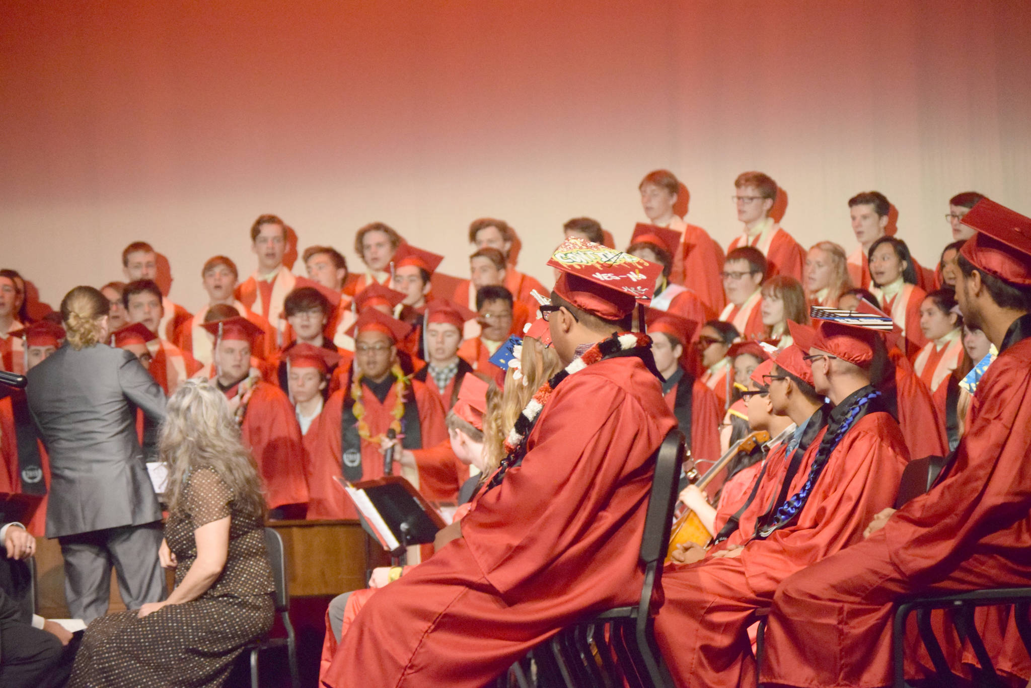 The class of 2019 listens to the choir perform during the Kenai Central High School 2019 graduation in Kenai, Alaska on May 21, 2019. (Photo by Brian Mazurek/Peninsula Clarion)