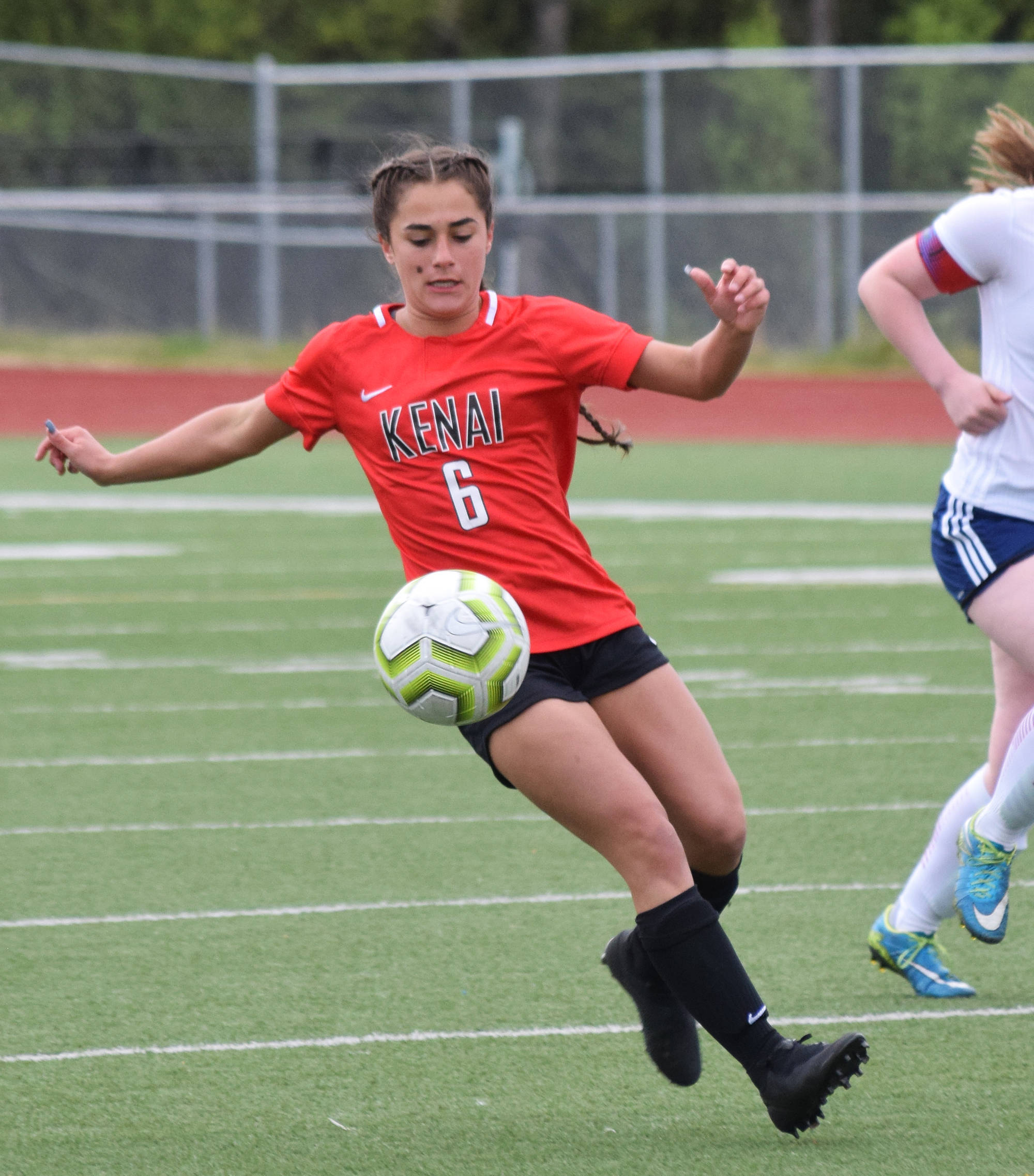 Kenai’s Alyssa Bucho works the ball up field against North Pole Thursday, May 23, 2019, at the Div. II state soccer championships in Eagle River. (Photo by Joey Klecka/Peninsula Clarion)