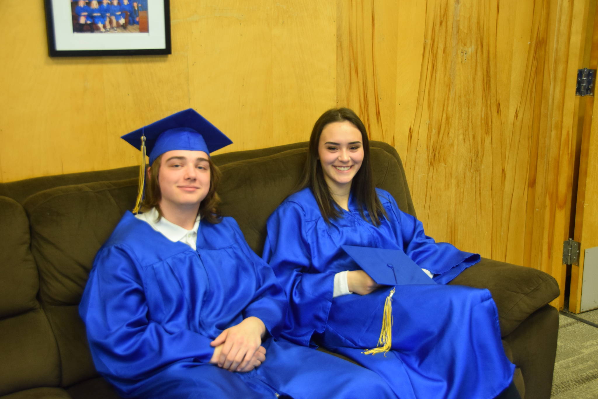 Titan Griffin, left, and Nereid Phillips, right, smile for the camera during the Kenai Alternative High School 2019 graduation in Kenai, Alaska on May 22, 2019. (Photo by Brian Mazurek/Peninsula Clarion)