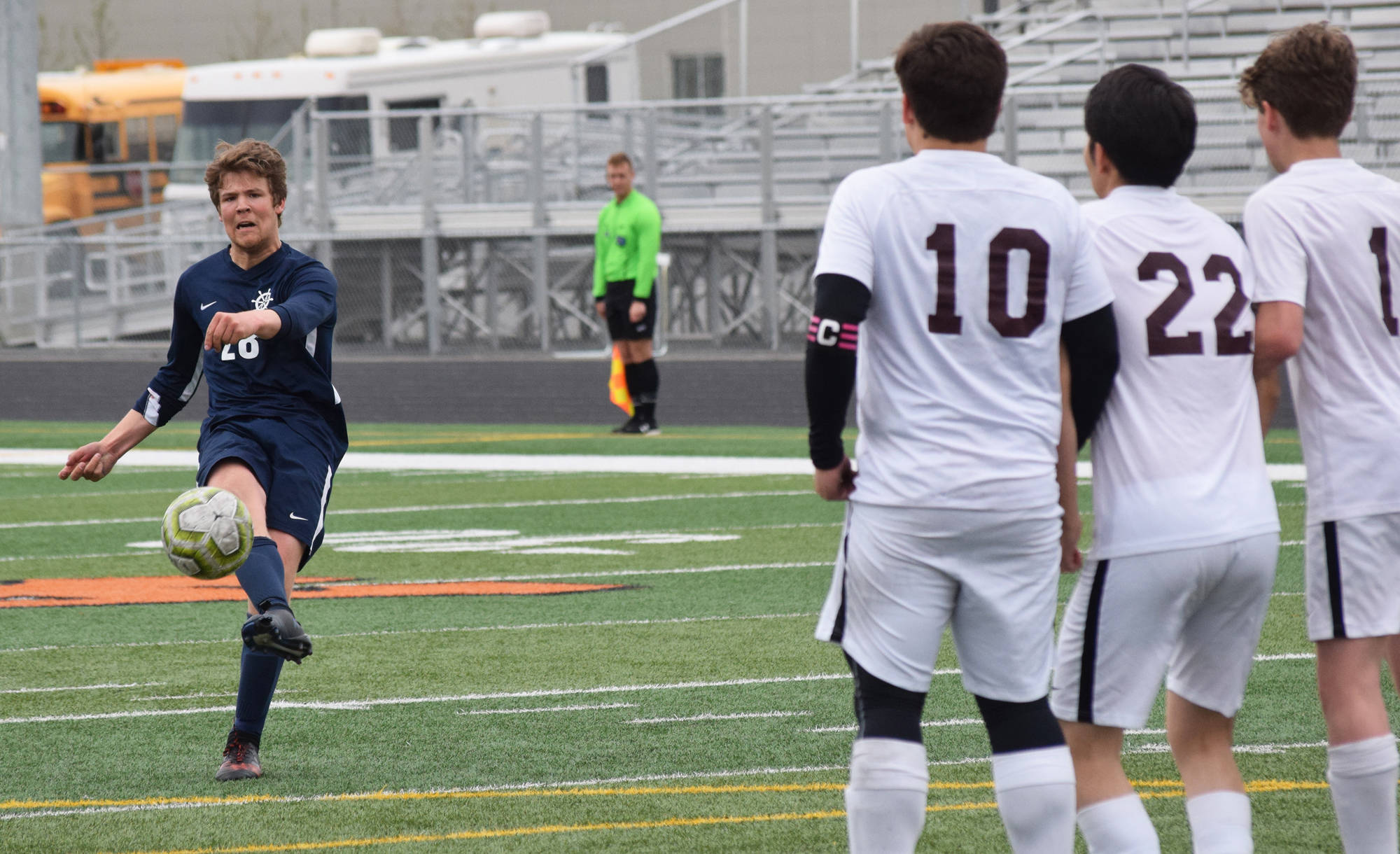 Homer’s Phinny Weston delivers a free kick against a line of Ketchikan defenders Thursday, May 23, 2019, at the Div. II state soccer championships at West High School. (Photo by Joey Klecka/Peninsula Clarion)