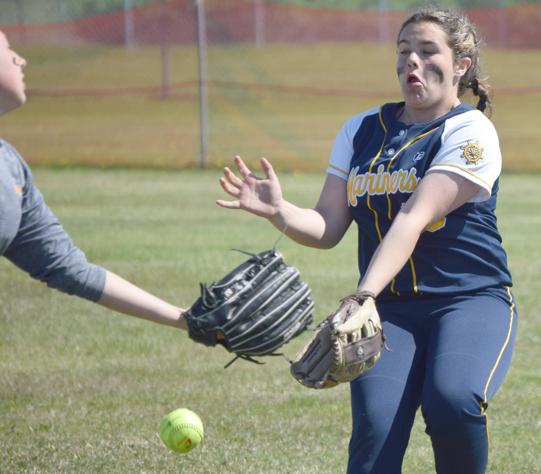 A ball hit by Bailey Smith of Soldotna drops between Homer second baseman Hannah Hatfield and right fielder Zoe Adkins on Friday, May 24, 2019, during the Northern Lights Conference softball tournament at Steve Shearer Memorial Ball Park in Kenai, Alaska. (Photo by Jeff Helminiak/Peninsula Clarion)