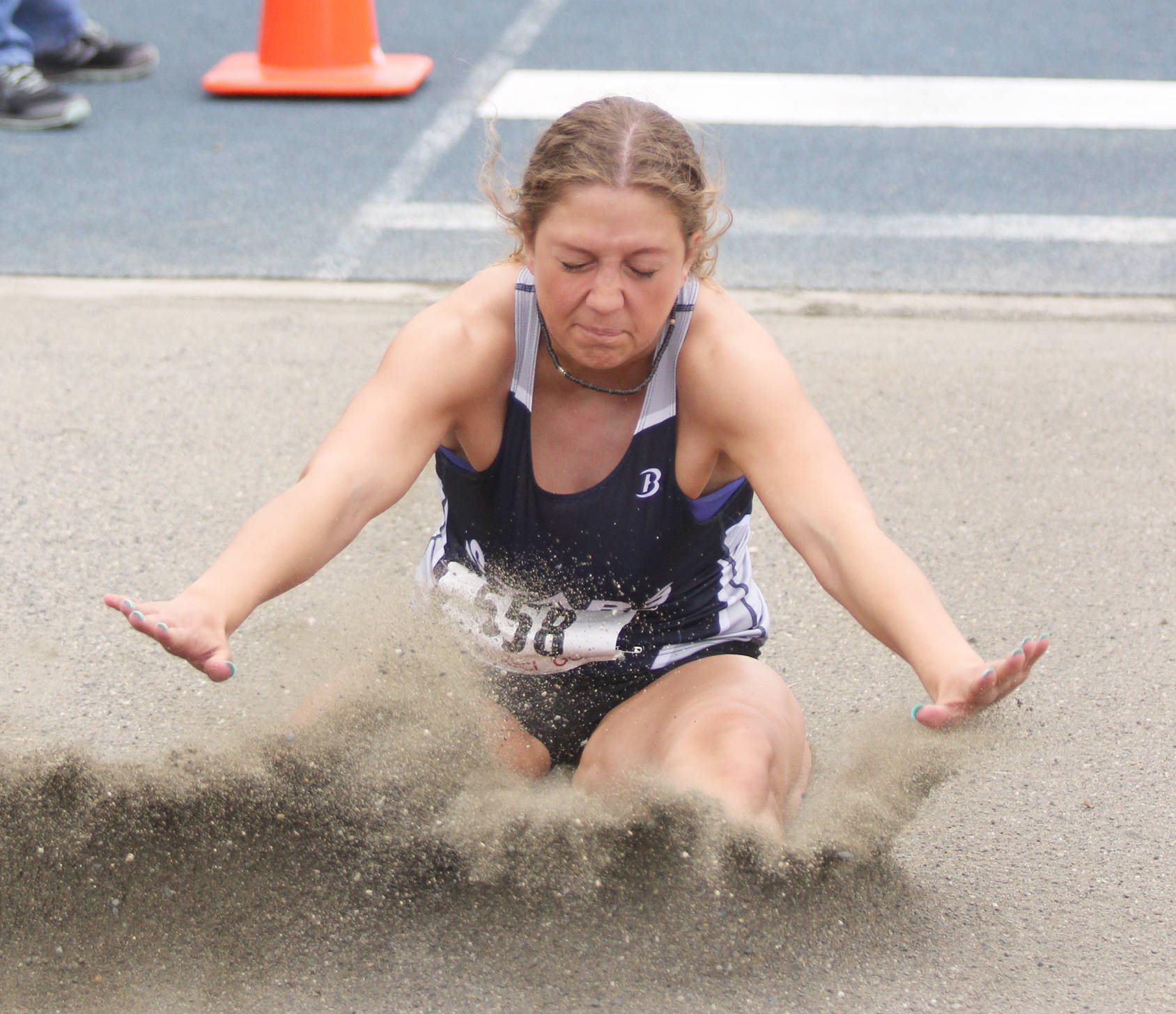 Soldotna’s Kylie Ness lands in the put during the Division I girls’ long jump of the ASAA/First National State Track and Field Championships Friday, May 24, 2019, at Palmer High School.
