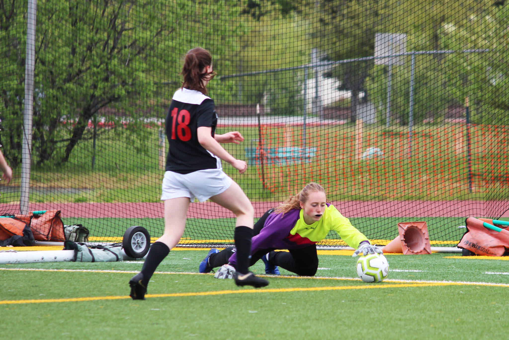 Soldotna goalkeeper Katie Delker gets a hand on the ball during the championship game of the Division II state soccer tournament Saturday, May 25, 2019 at Service High School in Anchorage, Alaska. (Photo by Megan Pacer/Homer News)