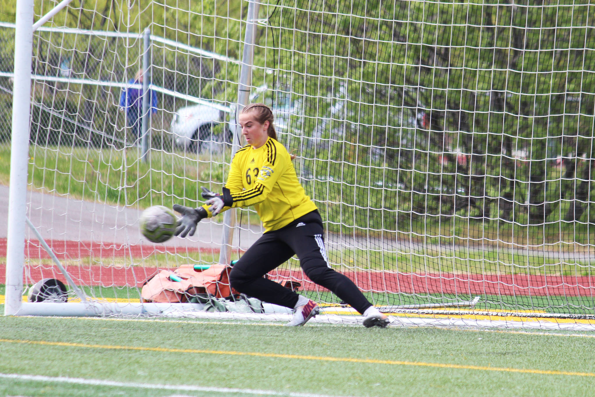 Thunder Mountain goalkeeper Samantha Dilley makes a save on a penalty kick from Soldotna during a semifinal game of the Division II state soccer championships on Friday, May 24, 2019 at Service High School in Anchorage, Alaska. (Photo by Megan Pacer/Homer News)