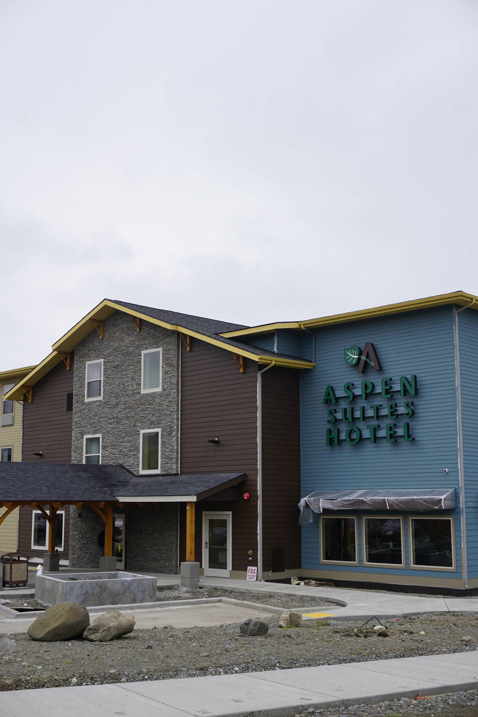 Workers finish up the new Homer Aspen Suites Hotel on May 21, 2019, in Homer, Alaska. The 72-room hotel opens on May 27. (Photo by Michael Armstrong/Homer News)