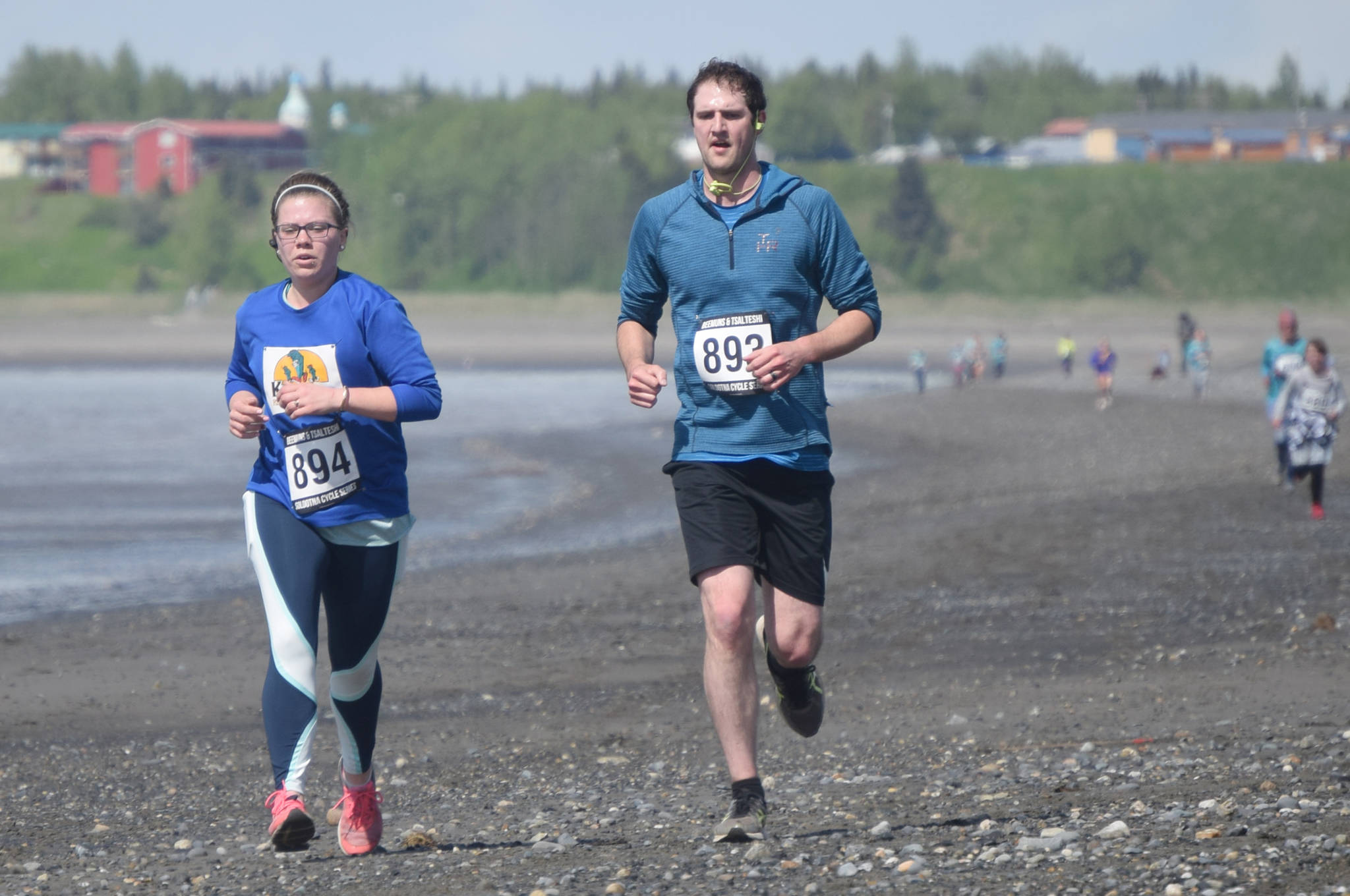 Chloe and Elijah Deatherage of Kenai, Alaska, race in the three-mile run of the Mouth to Mouth Wild Run and Ride on Monday, May 27, 2019, at the Kenai beach. Chloe was using the event to get back into running. She said she’d never run on the beach before, but would definitely do it again. Elijah would later win the drawing for the fat bike. (Photo by Jeff Helminiak/Peninsula Clarion)                                Chloe and Elijah Deatherage of Kenai, Alaska, race in the three-mile run of the Mouth to Mouth Wild Run and Ride on Monday, May 27, 2019, at the Kenai beach. Chloe was using the event to get back into running. She said she’d never run on the beach before, but would definitely do it again. Elijah would later win the drawing for the fat bike. (Photo by Jeff Helminiak/Peninsula Clarion)