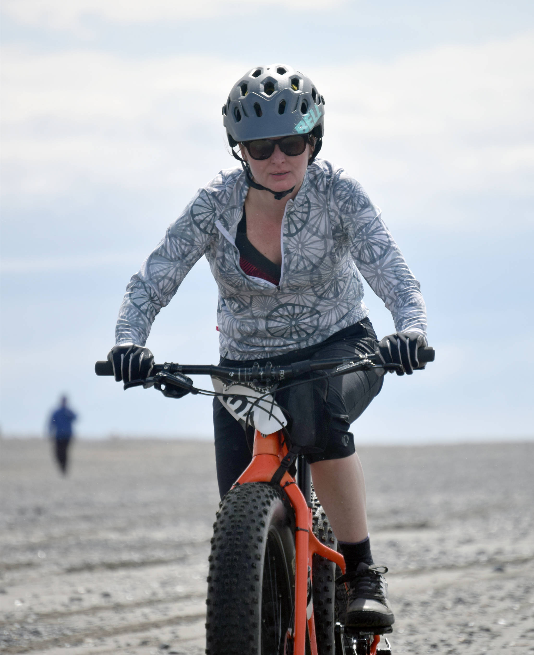 Jen Showalter rides to victory in the 10-mile bike at the Mouth to Mouth Wild Run and Ride on Monday, May 27, 2019, at the beach in Kenai, Alaska. (Photo by Jeff Helminiak/Peninsula Clarion)