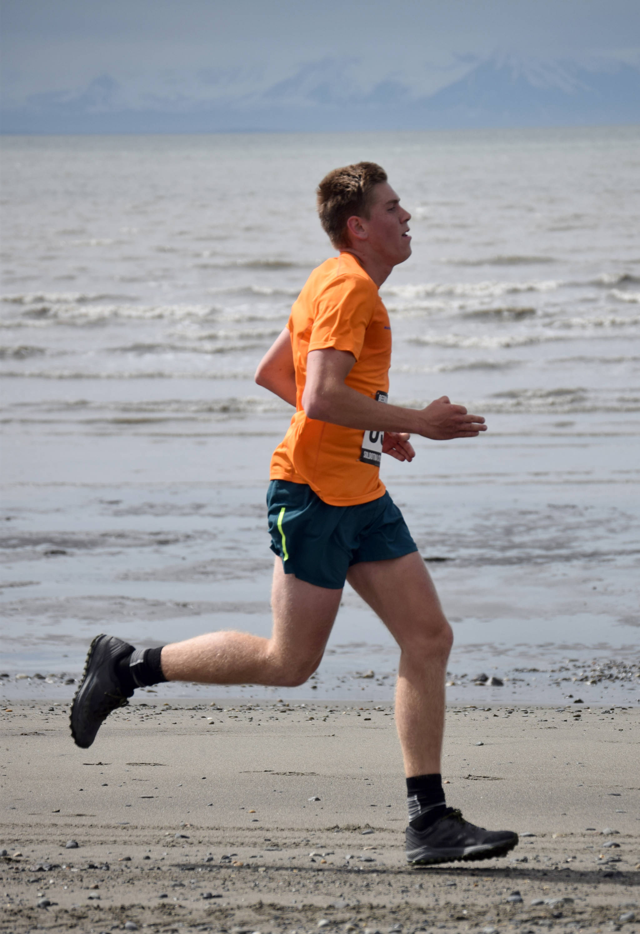 Will Steffe runs to victory in the 10-miler at the Mouth to Mouth Wild Run and Ride on Monday, May 27, 2019, at the beach in Kenai. Alaska. (Photo by Jeff Helminiak/Peninsula Clarion)