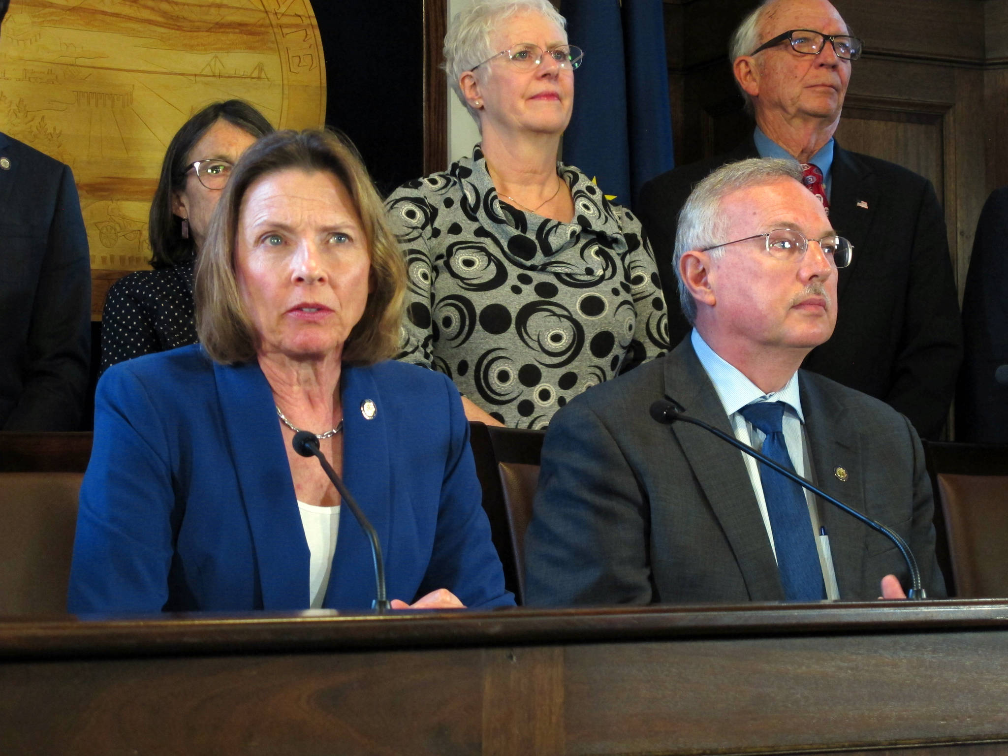 Alaska Senate President Cathy Giessel, seated left, speaks during a news conference on education funding held by state House and Senate leadership on Tuesday, May 28, 2019, in Juneau, Alaska. Seated beside her is House Speaker Bryce Edgmon. (AP Photo/Becky Bohrer)