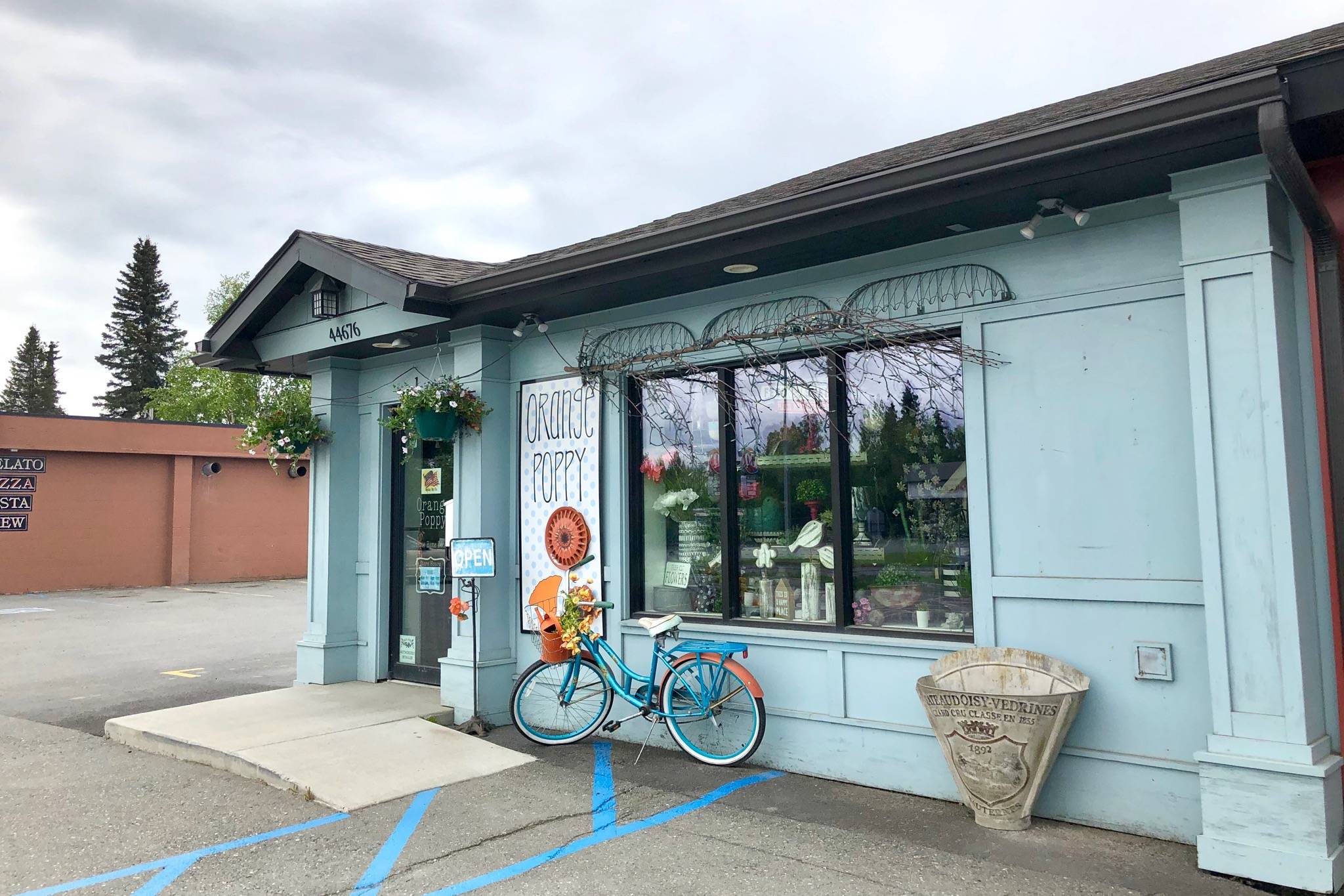 Orange Poppy, one of several businesses that have improved their storefronts with the help of Soldotna’s Storefront Improvement Program, is photographed Wednesday, May 29, 2019, in Soldotna, Alaska. The improvement program awards grants to local businesses wanting to beautify their building’s exterior. (Photo by Victoria Petersen/Peninsula Clarion)