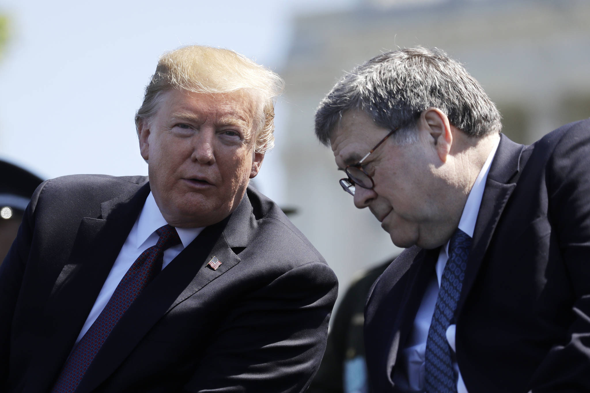 In this May 15, 2019, file photo, President Donald Trump and Attorney General William Barr speak at the 38th Annual National Peace Officers’ Memorial Service at the U.S. Capitol in Washington. Trump is directing the U.S. intelligence community to “quickly and fully cooperate” with Barr’s investigation of the origins of the multi-year probe into whether Trump’s 2016 campaign colluded with Russia (AP Photo/Evan Vucci, File)