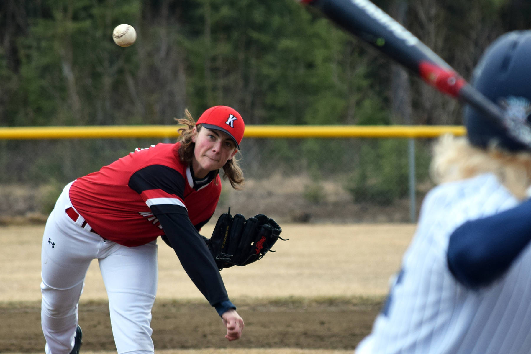 Kenai Central pitcher Gavin Petterson delivers a ball to Soldotna batter Kenny Griffin at the Soldotna baseball fields in April 2016. (Photo by Joey Klecka/Peninsula Clarion)