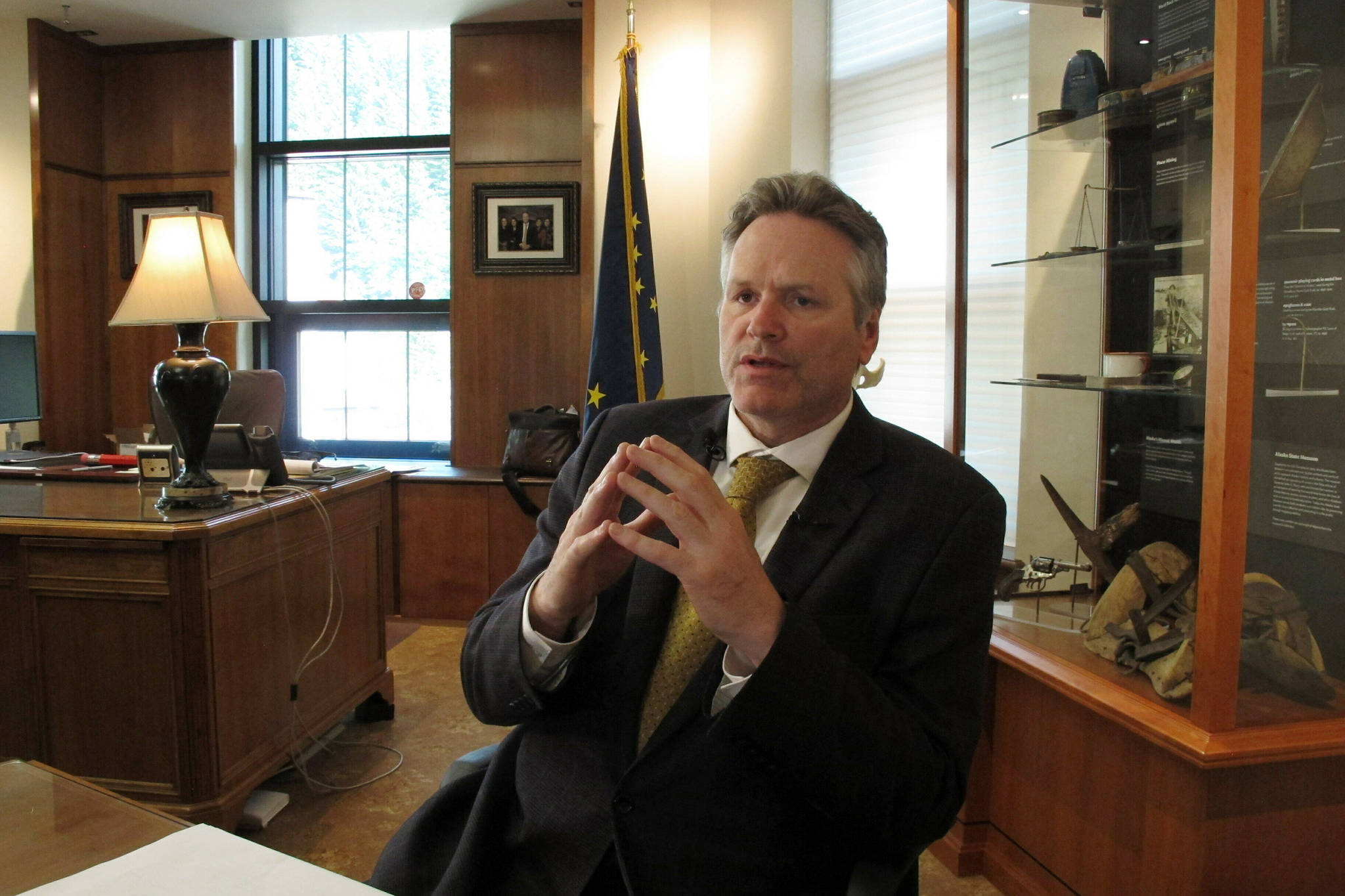 Alaska Gov. Mike Dunleavy speaks to reporters in his office at the state Capitol on Wednesday, May 29, 2019, in Juneau, Alaska. Dunleavy says he’s hopeful the Legislature will pass a budget next week but says his administration is preparing in case that doesn’t happen. (AP Photo/Becky Bohrer)