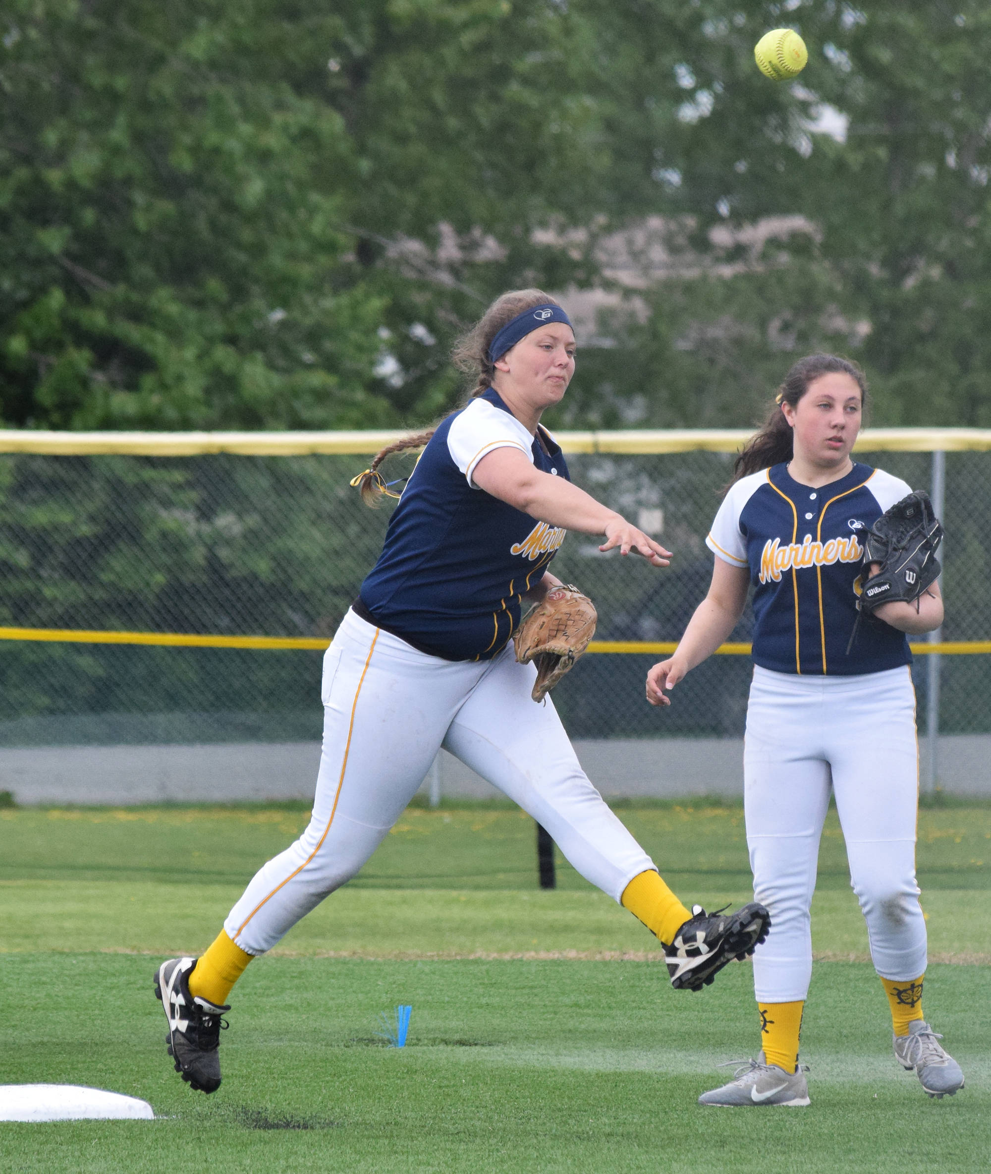 Homer’s Kaitlyn Johnson (left) attempts to turn a double play against Delta Junction at the Division II state softball tournament Friday, May 31, 2019, at Cartee Fields in Anchorage, Alaska.