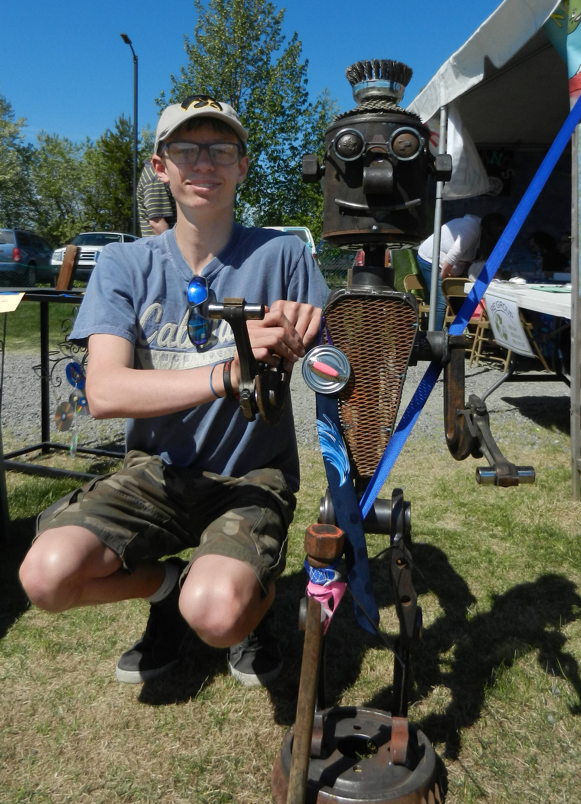 Jake Nabholtz displays his winning youth entry in the large sculpture category at the 2018 Salvage Art Exhibit in the Kenai River Festival. (Photo provided by ReGroup Recycling)