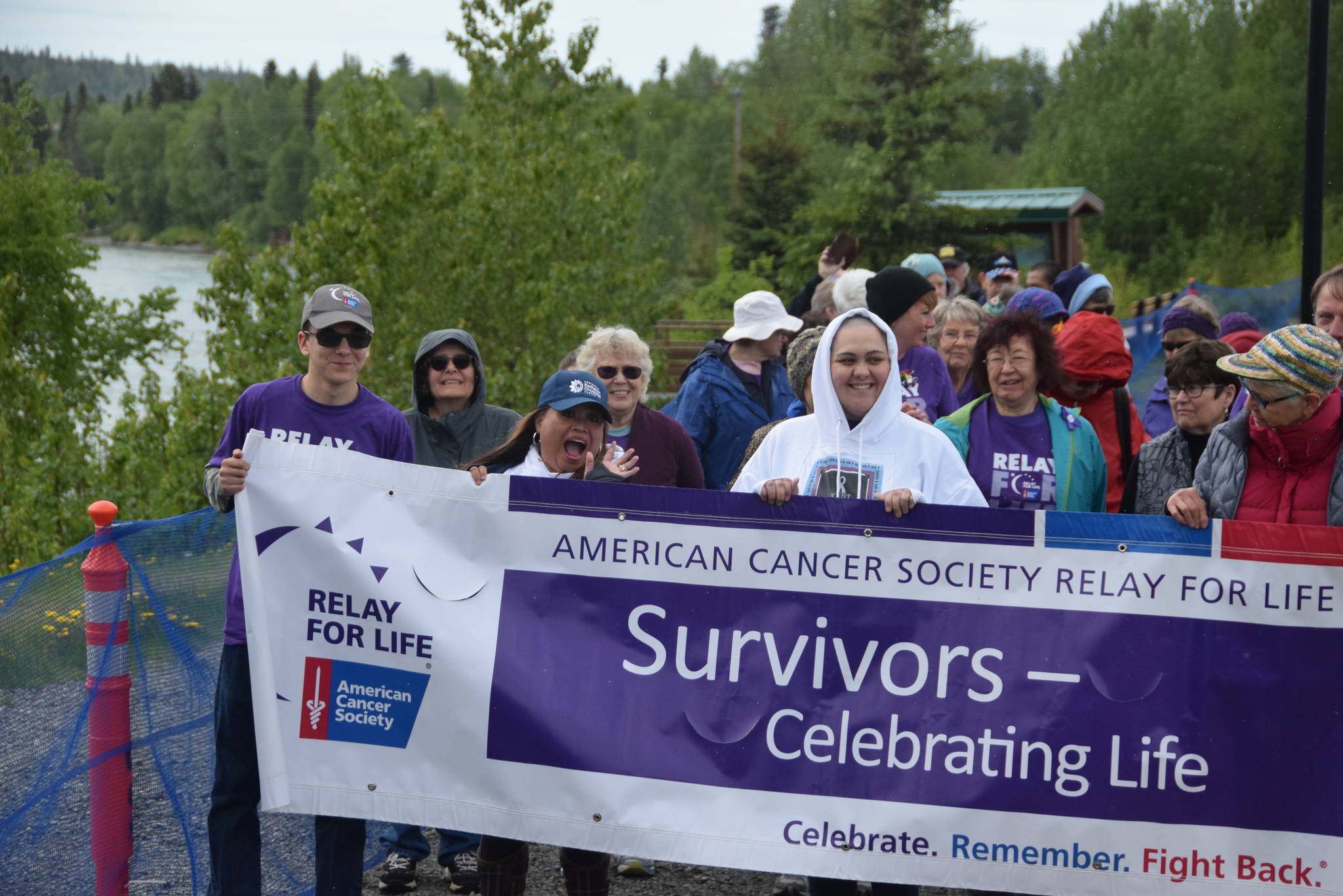 Participants at the 2019 Relay for Life of the Kenai Peninsula line up at Soldotna Creek Park on June 1, 2019 to start the survivor’s walk, which is designated for cancer survivors and their caretakers. All those wearing purple shirts are cancer survivors, including Joseph Yourkoski, far left, a 17 year old at Nikiski High School. Eighteen teams raised over $25,000 at this year’s event, which featured live entertainment, face painting and a pancake eating contest. (Photo by Brian Mazurek/Peninsula Clarion)