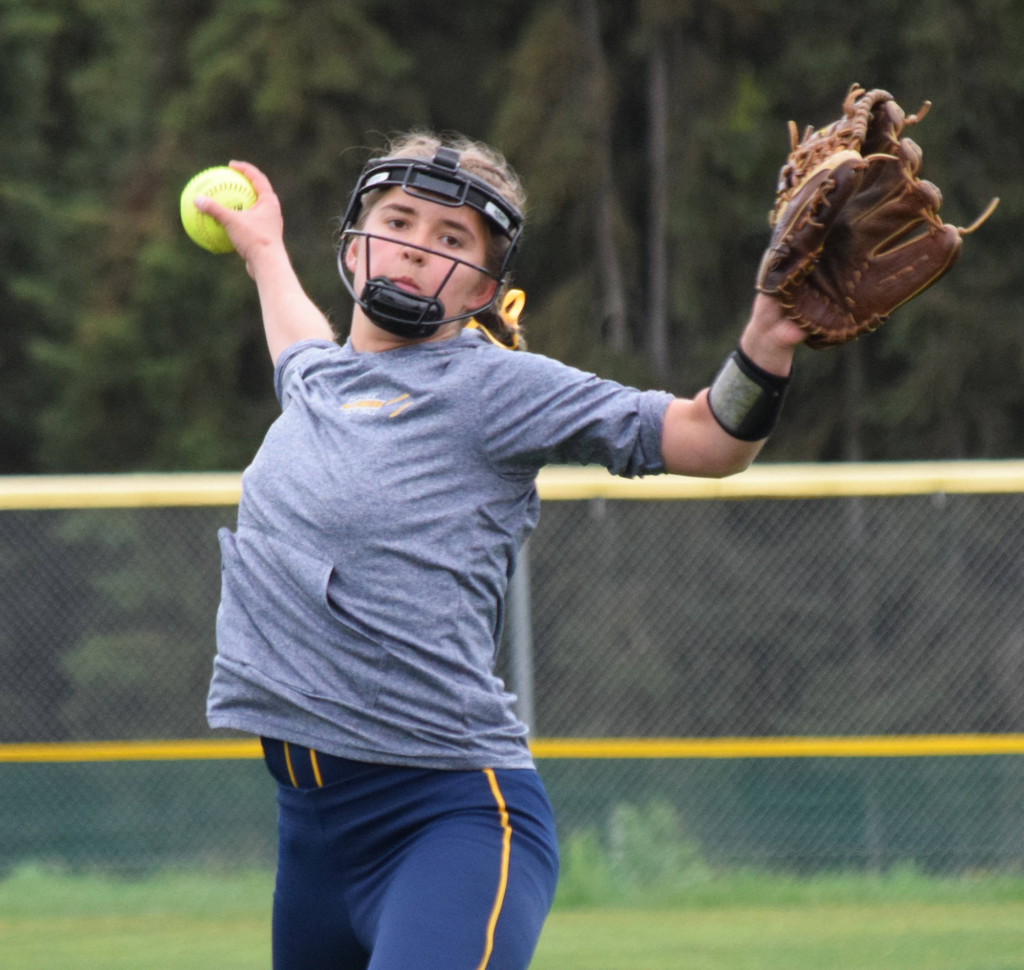 Homer’s Annalynn Brown winds up for a pitch to a Ketchikan batter at the Division II state softball tournament Saturday, June 1, 2019, at Cartee Fields in Anchorage. (Photo by Joey Klecka/Peninsula Clarion)