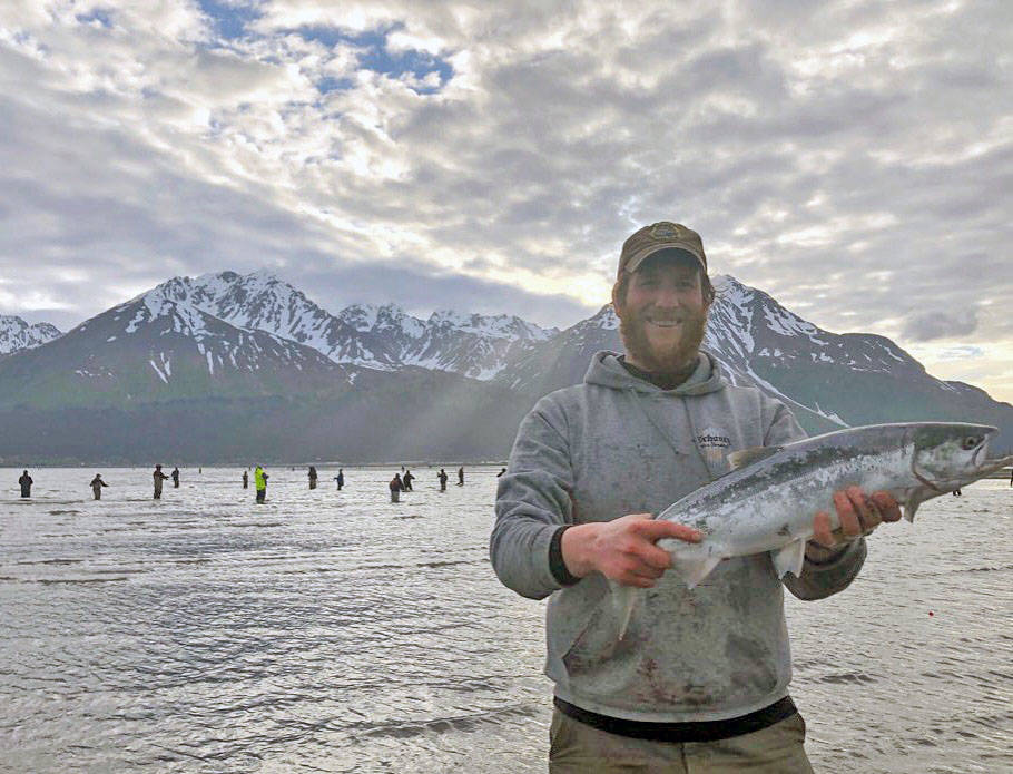 Peter Frank of Seward displays a sockeye salmon he caught in Resurrection Bay in Seward on Saturday. (Photo submitted by Gillian Braver)