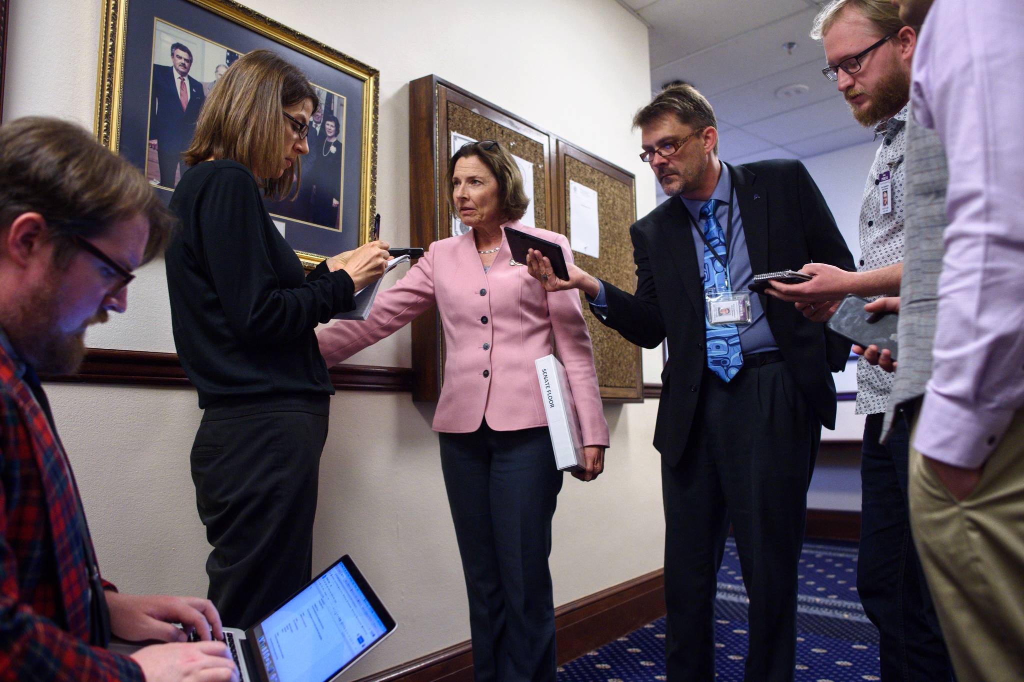 Senate President Cathy Giessel, R-Anchorage, center, is interviewed by members of the media after a “call” on the Senate was lifted on Thursday, June 6, 2019 (Michael Penn | Juneau Empire)
