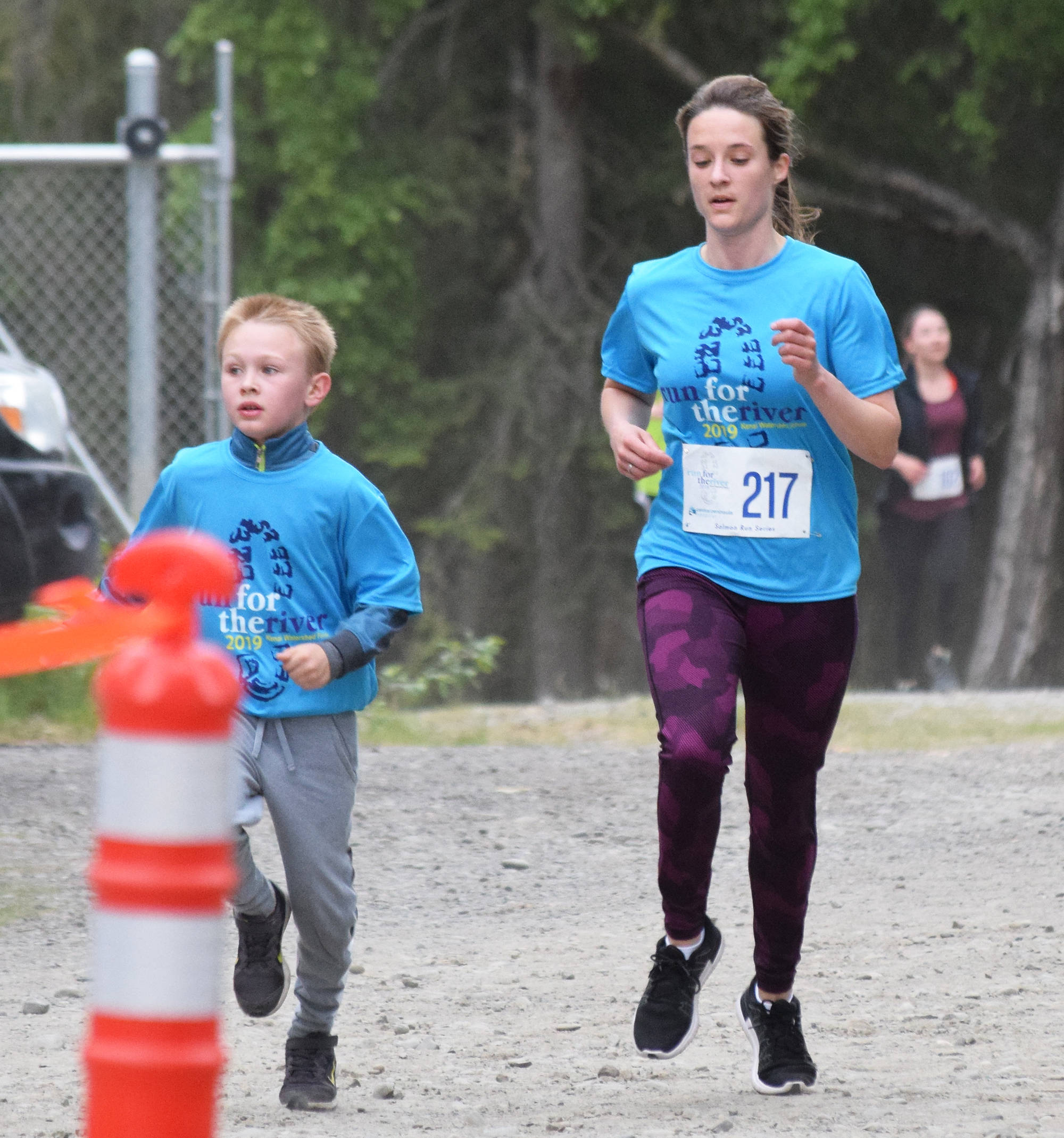Amanda Millay races to the finish line Saturday, June 8, 2019, at the Run for the River 5-kilometer/10-mile races in Soldotna, Alaska. (Photo by Joey Klecka/Peninsula Clarion)