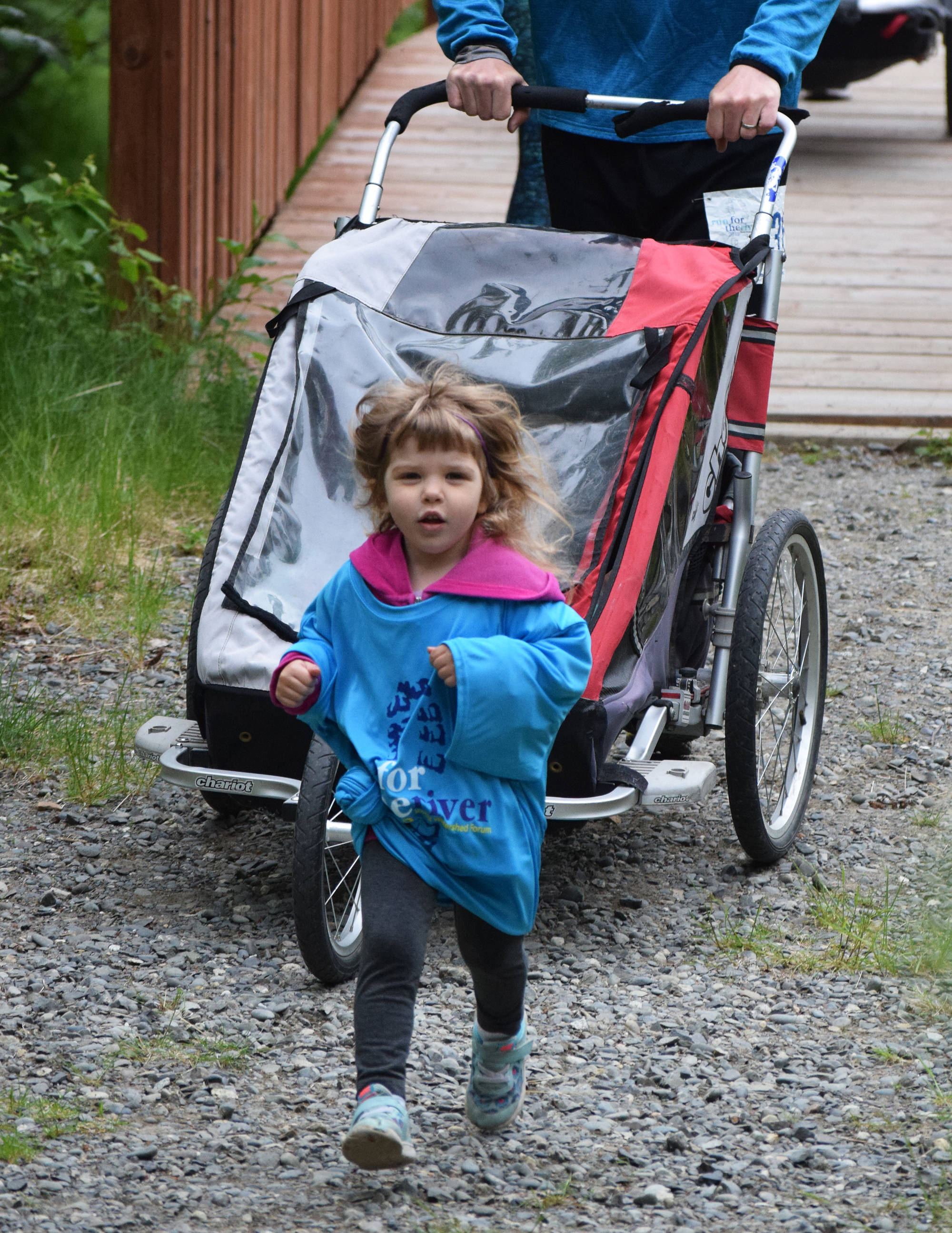 A young runner makes her way down the trail Saturday, June 8, 2019, at the Run for the River 5-kilometer/10-mile races in Soldotna, Alaska. (Photo by Joey Klecka/Peninsula Clarion)