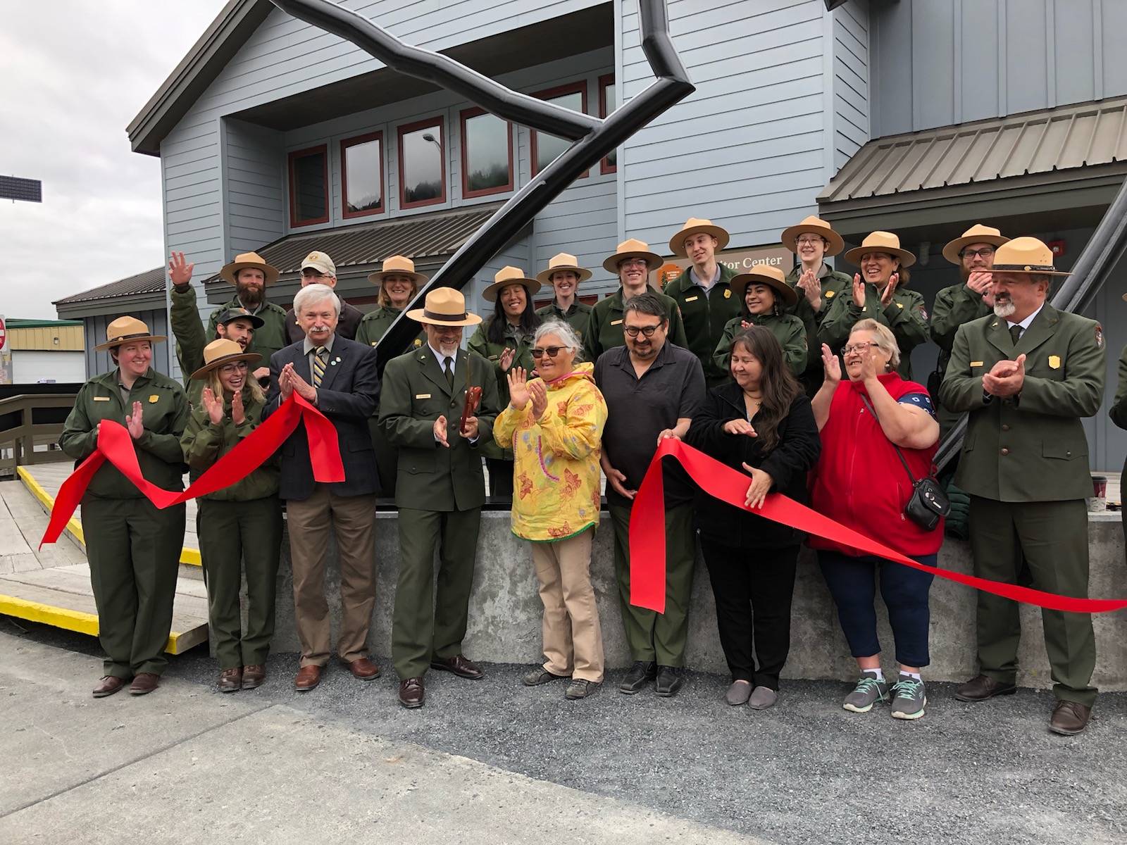 Kenai Fjords National Park employees and representatives from the Nanwalek tribe cut the ribbon at the newly renovated visitors center on Fourth Avenue in Seward, Alaska. (Photo submitted by NPS Shauna Potocky)