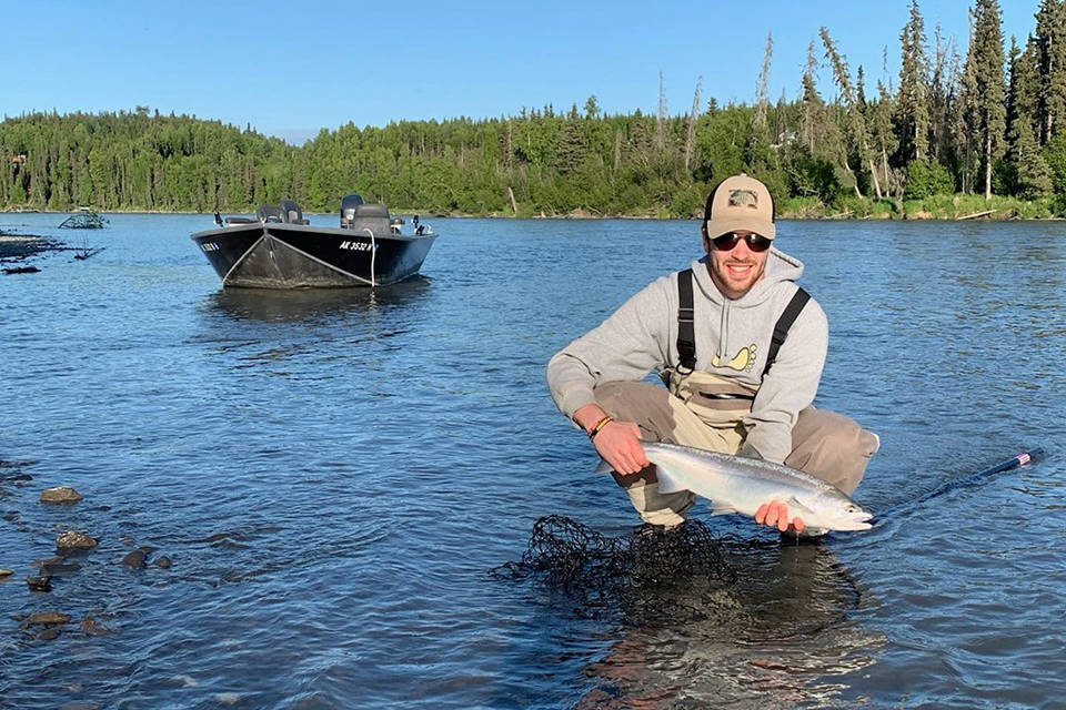 An angler shows off his early run sockeye on the Kenai River in June 2019 near Kenai, Alaska. (Photo submitted by Jason Foster)