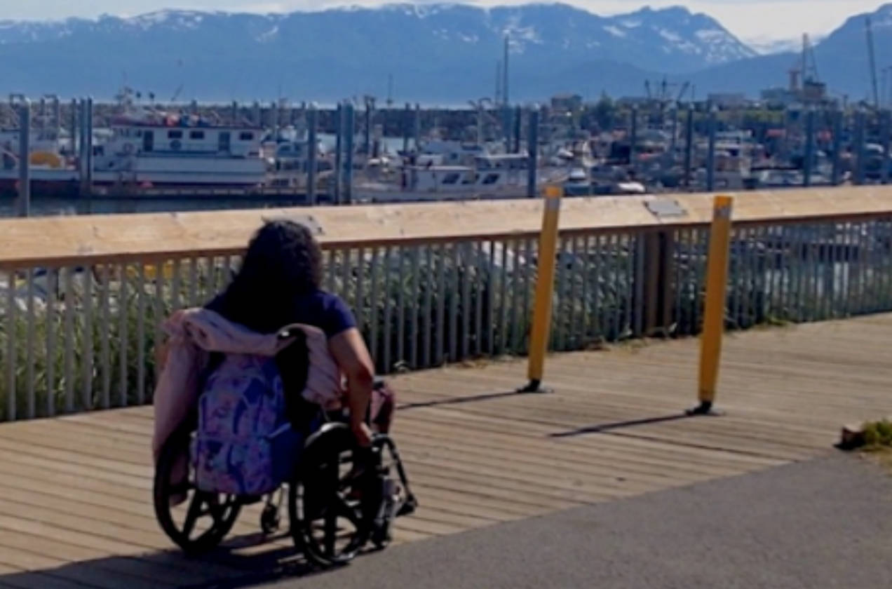 A woman in a wheelchair uses the Homer Harbor boardwalk in an undated photo taken in Homer, Alaska. (Photo provide/Independent Living Center)