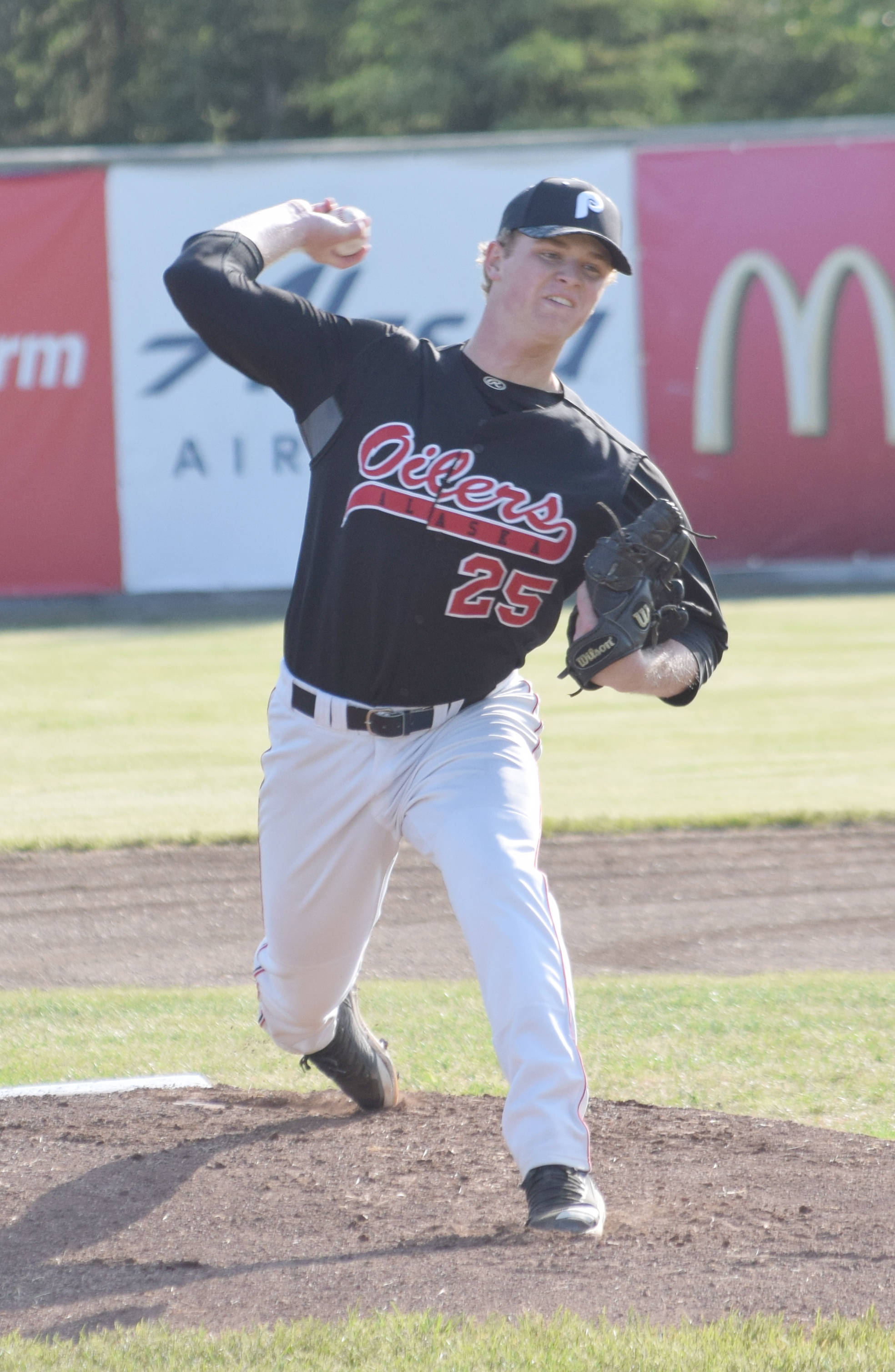 Peninsula Oilers pitcher Jake Fenn delivers to the Chugiak-Eagle River Chinooks on Thursday, June 13, 2019, at Coral Seymour Memorial Park in Kenai, Alaska. (Photo by Jeff Helminiak/Peninsula Clarion)