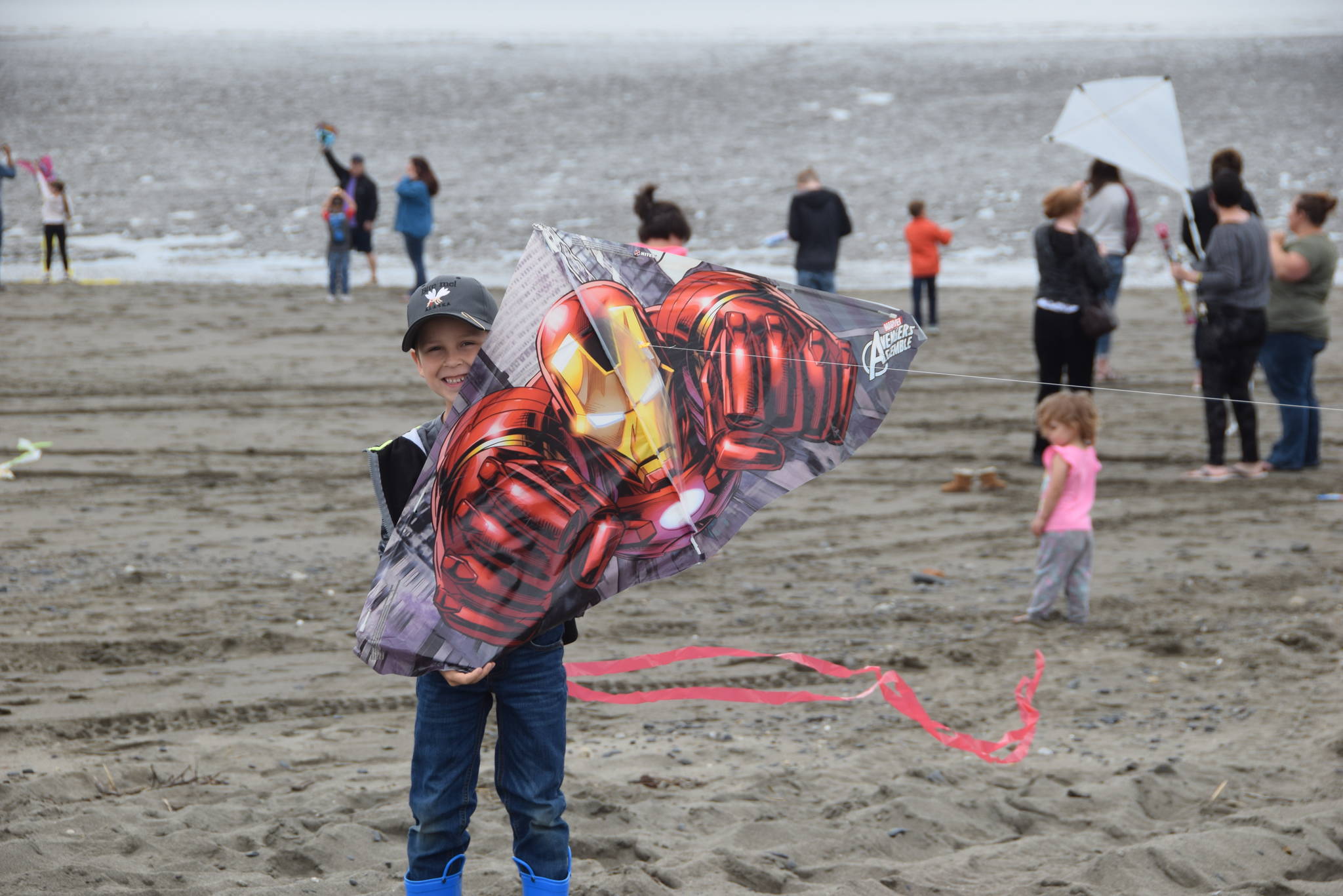 Jasper Webb from Kenai shows off his Iron Man kite during the first Kenai Kite Festival on the Kenai North Beach in Alaska on Saturday, June 15, 2019. (Photo by Brian Mazurek/Peninsula Clarion)