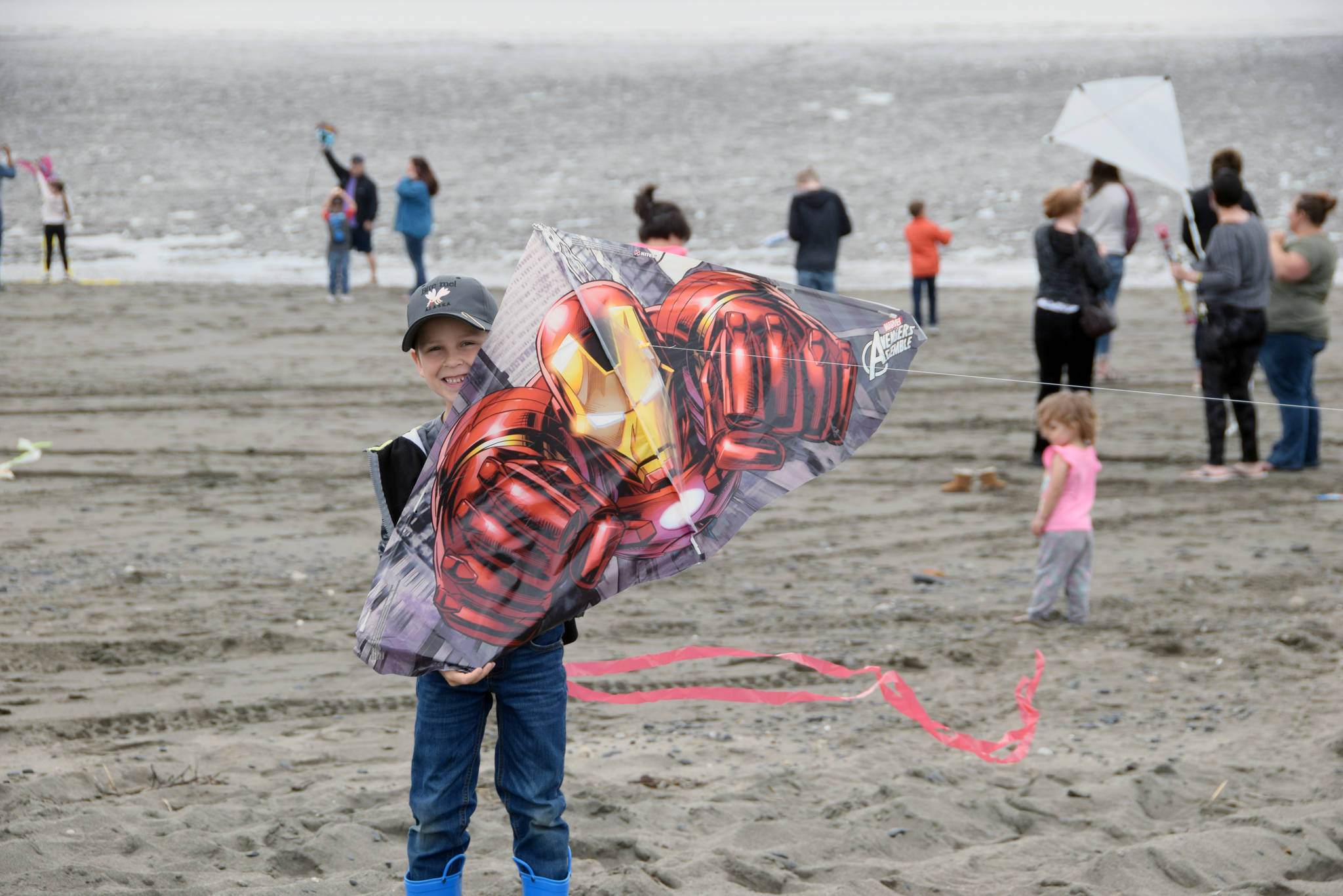 Jasper Webb from Kenai shows off his Iron Man kite during the first Kenai Kite Festival on the Kenai North Beach in Alaska on Saturday, June 15, 2019. (Photo by Brian Mazurek/Peninsula Clarion)