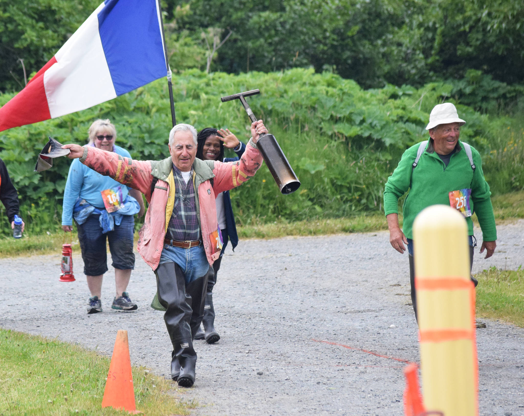 French walkers Pierre Morell (right) and Jean-Phillip Hullen approach the finish line Saturday at the Ninilchik Clam Scramble Mud and Obstacle Run in Ninilchik, Alaska. (Photo by Joey Klecka/Peninsula Clarion)