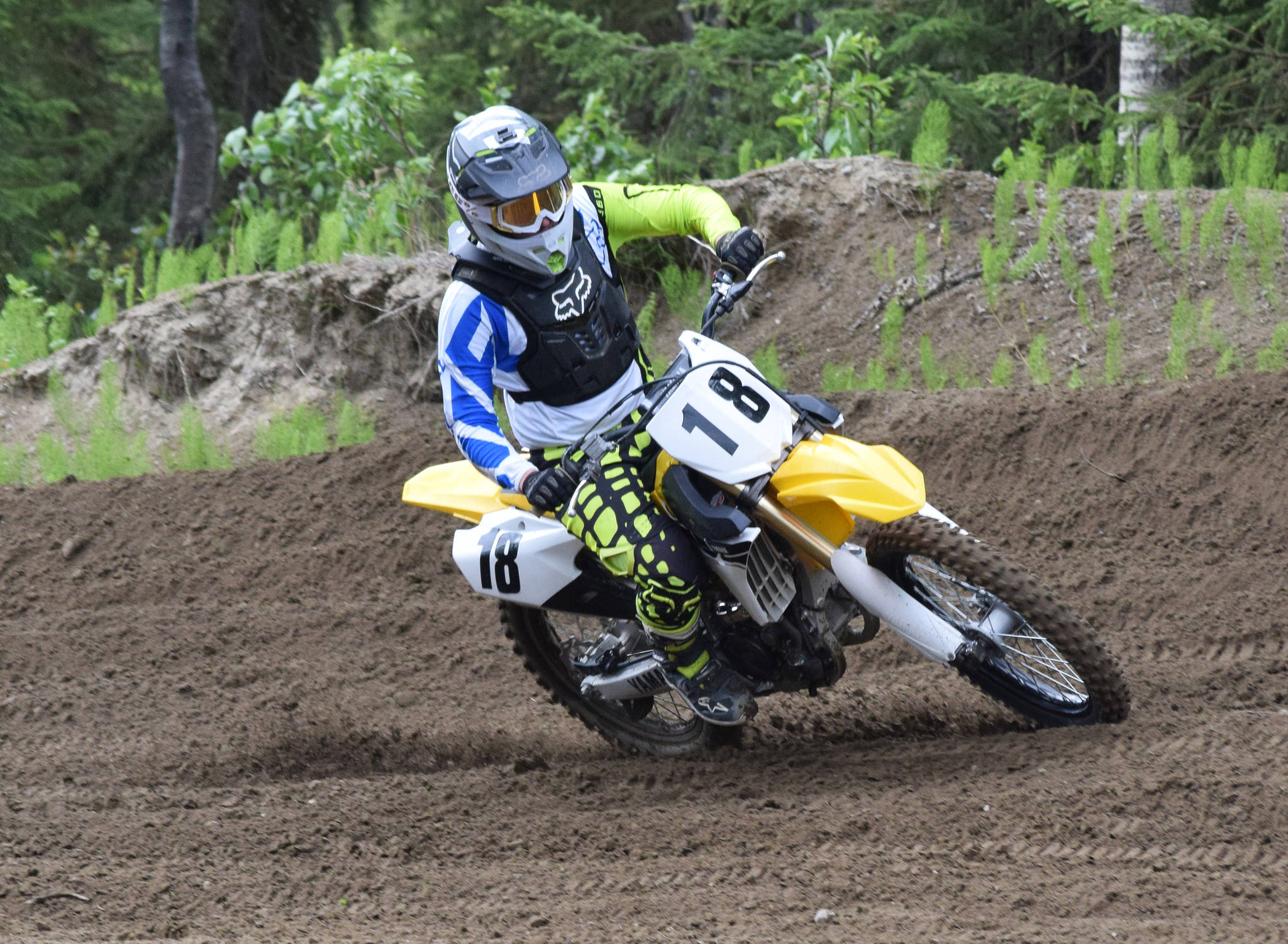 Hayden Bragg rounds a corner Saturday, June 15, 2019, at the Alaska State Motocross Championships at Twin City Raceway’s motocross track in Kenai, Alaska. (Photo by Joey Klecka/Peninsula Clarion)