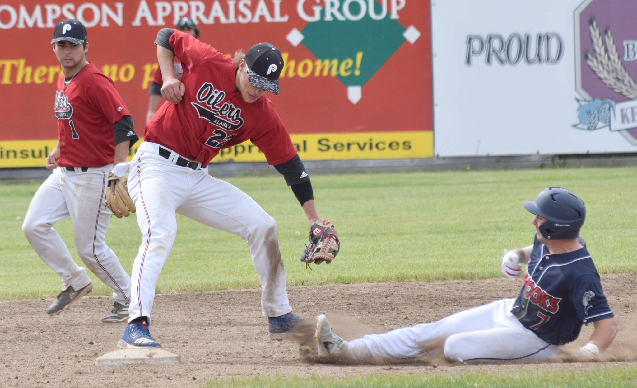 Oilers shortstop Skyler Messinger records a force out on Pate Fullerton before throwing to first base for a double play Sunday, June 16, 2019, at Coral Seymour Memorial Park in Kenai, Alaska. (Photo by Jeff Helminiak/Peninsula Clarion)