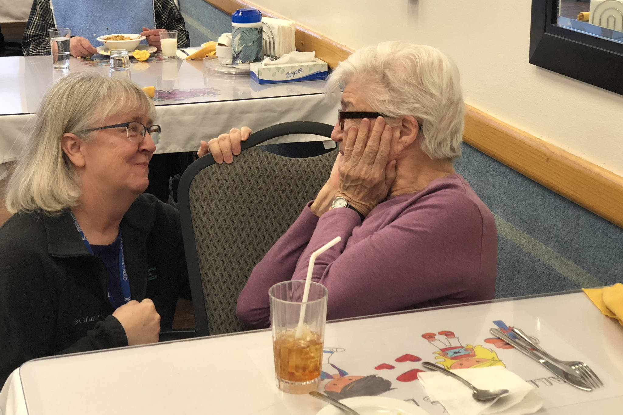 Central Peninsula Health Foundation Director Kathy Gensel, left, updates former Heritage Place Resident Council President MaryNell Larson about the Evening by the River Fundraiser in this undated photo. (Courtesy of Aud Walaszek/Heritage Place)