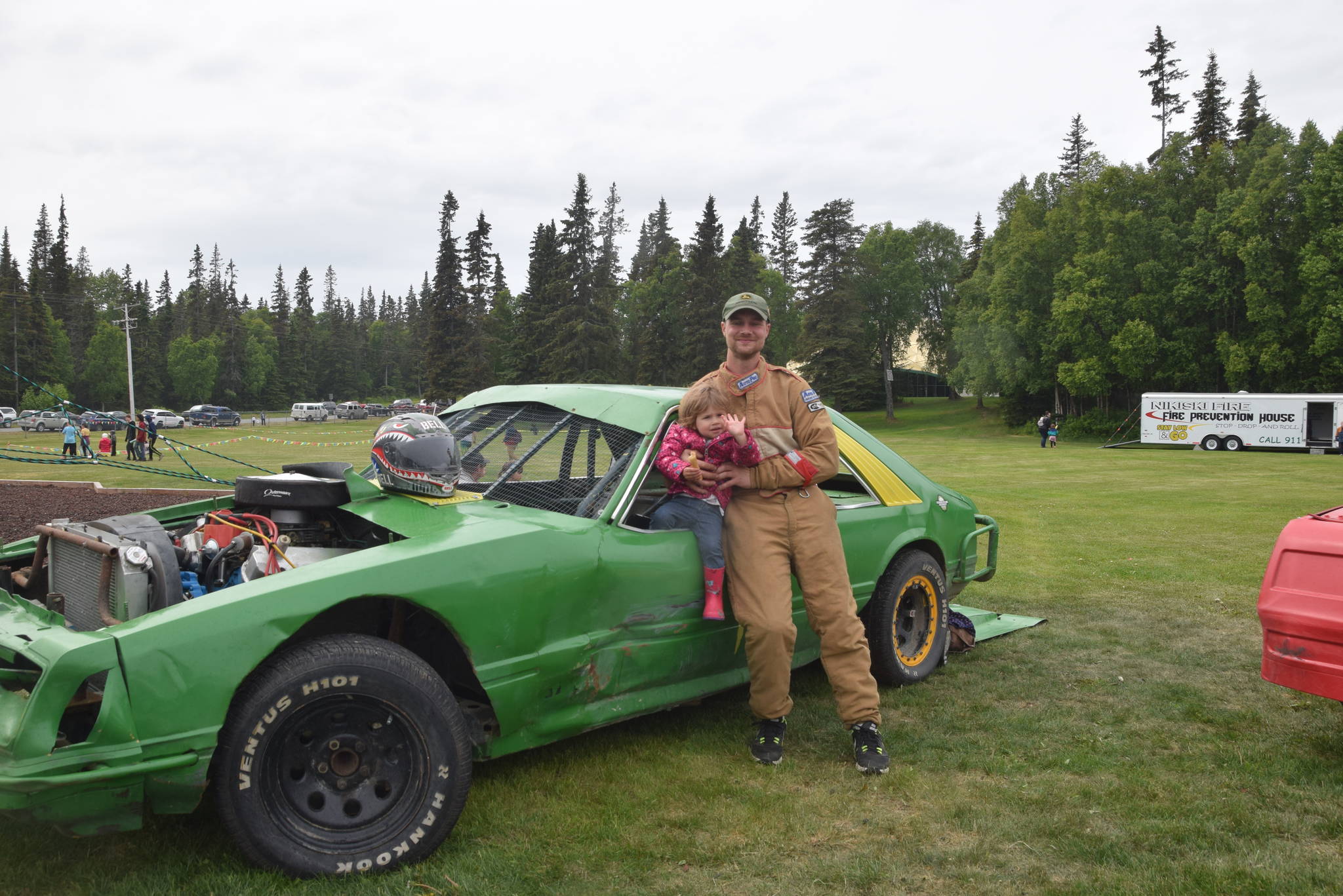 Dawson Hermanns and his daughter, Clara, pose with Hermann’s ‘84 Mustang during the Family Fun in the Midnight Sun festival at the North Peninsula Recreation Center in Nikiski, Alaska on June 15, 2019. (Photo by Brian Mazurek/Peninsula Clarion)
