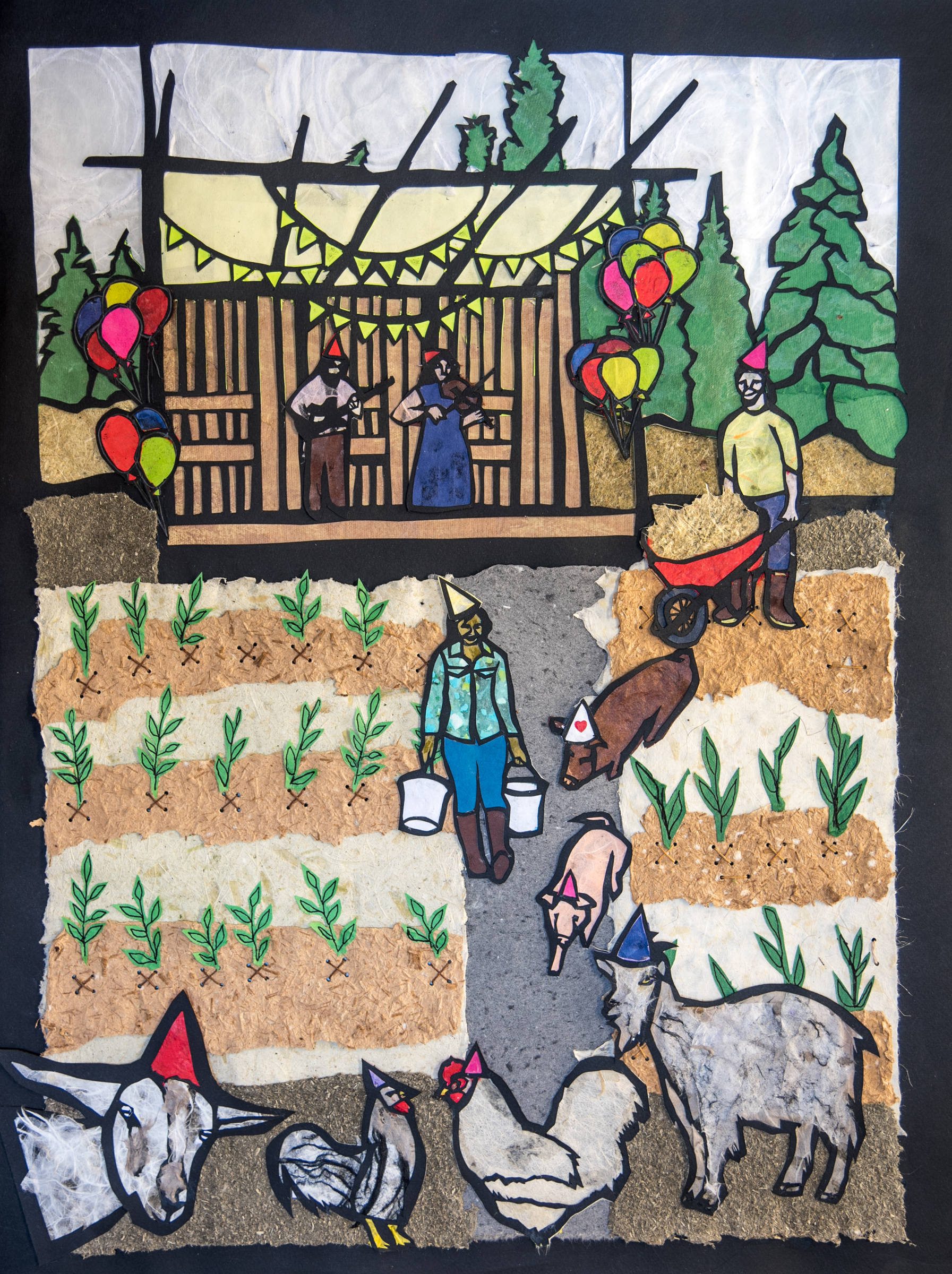 Desiree Hagen created this cut-paper illustration for the Homer Farmers Market’s 20th anniversary poster. (Photo by Brandon Hill)