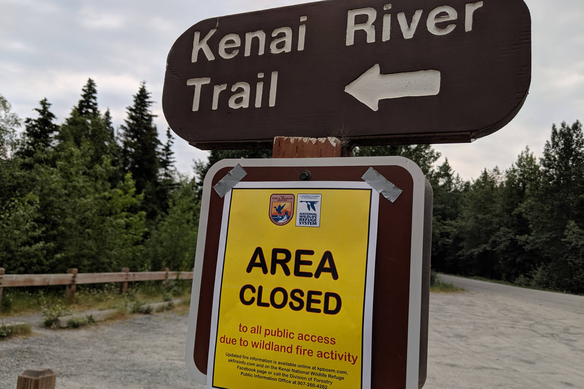 A sign for trail closures can be seen on Skilak Lake Road on Sunday, June 23, 2019. The Kenai Wildlife Refuge closed recreation areas, including Bottenintnin Lake, Watson Lake Campground, Egumen Lake Trail, Petersen Lake Campground, Kelly Campground, Seven Lakes Trail, Skyline Trail and Jean Lake Campground over the weekend. (Photo by Erin Thompson/Peninsula Clarion)