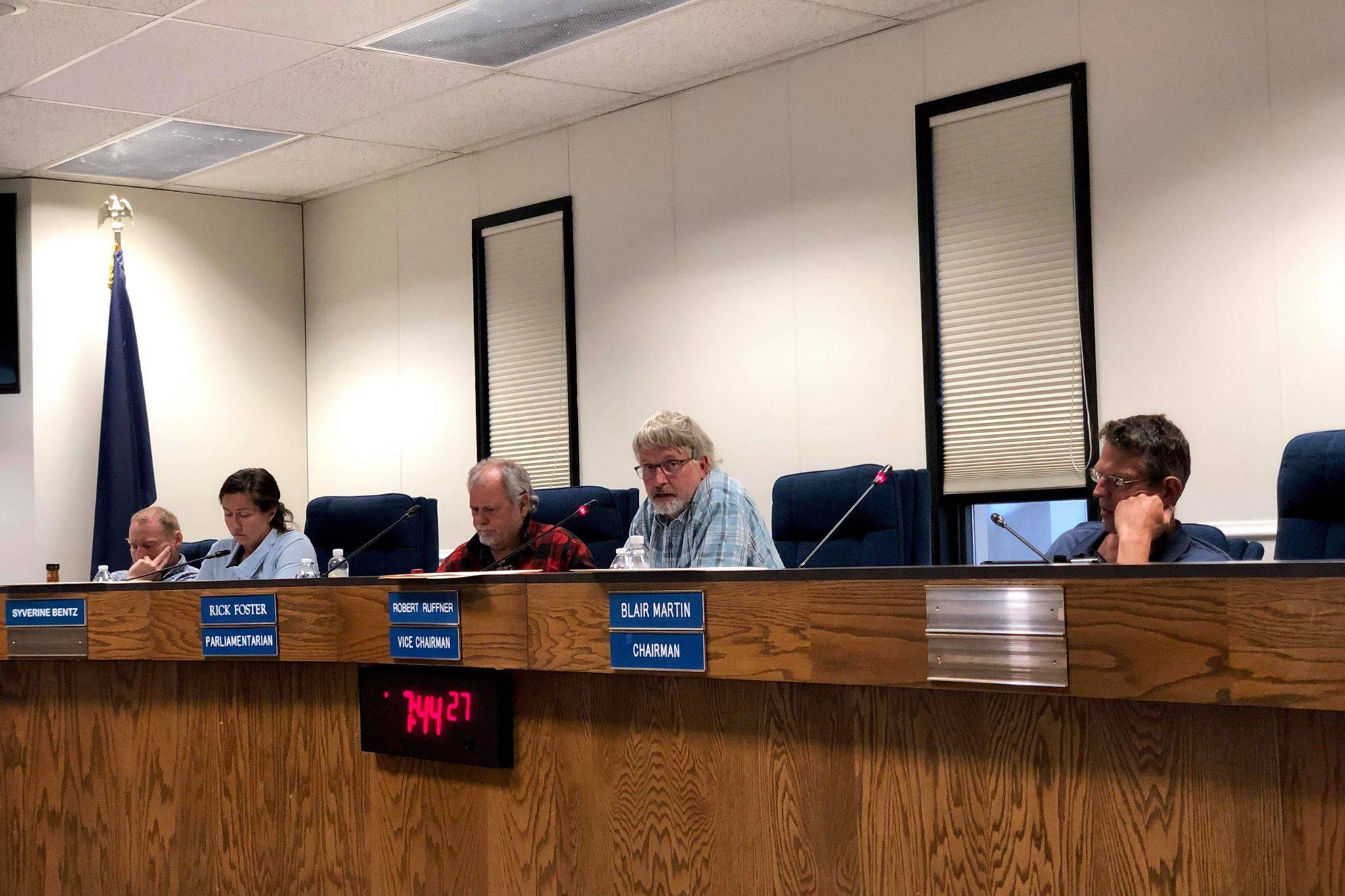 Kenai Peninsula Borough Planning Commission Chairman Blair Martin, Vice Chairman Robert Ruffner and Parliamentarian Rick Foster facilitate discussions on Emmitt Trimble’s Beachcomber LLC gravel pit permit application on Monday, June 24, 2019, in Soldotna, Alaska. (Photo by Victoria Petersen/Peninsula Clarion)