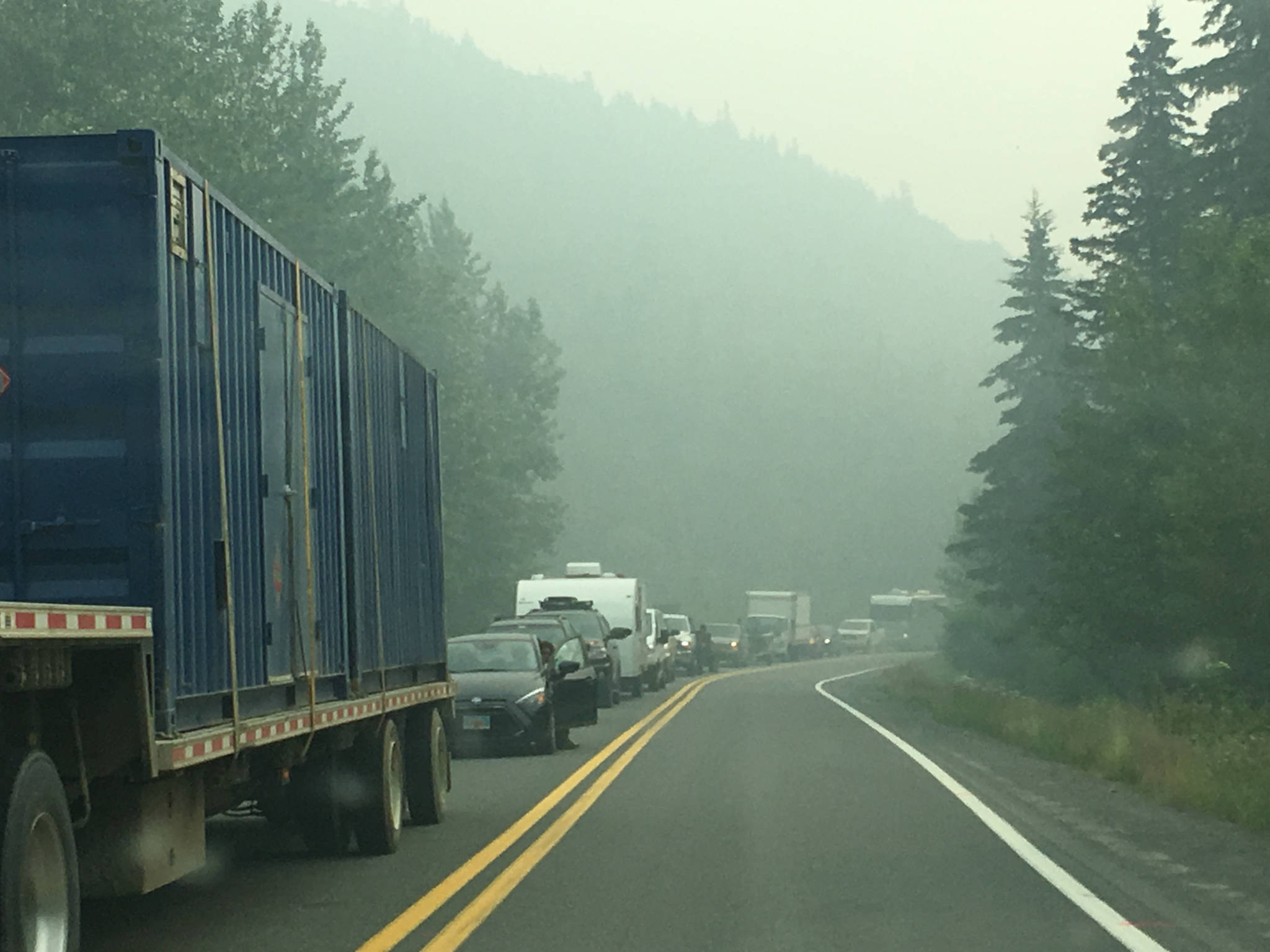 Cars are backed up along the Sterling Highway on Alaska’s Kenai Peninsula on Wednesday, June 26, 2019. The highway was closed for several hours Wednesday morning due to the Swan Lake Fire burning north of the highway. (Photo by Jeff Helminiak/Peninsula Clarion)