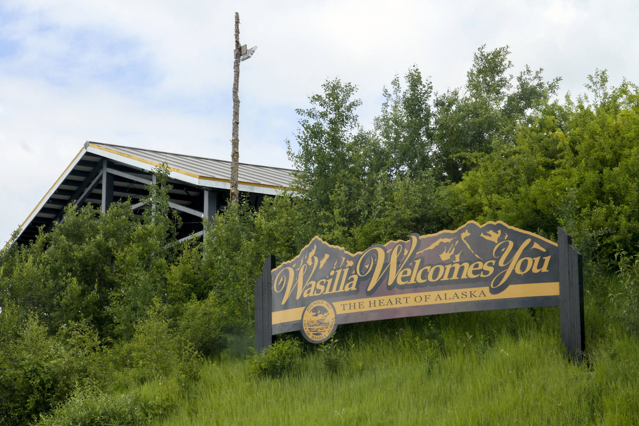 This June 14, 2019 file photo shows a welcome sign on the outskirts of Wasilla. State lawmakers have rejected Gov. Mike Dunleavy’s suggested location for a special session. (AP Photo/Mark Thiessen, File)
