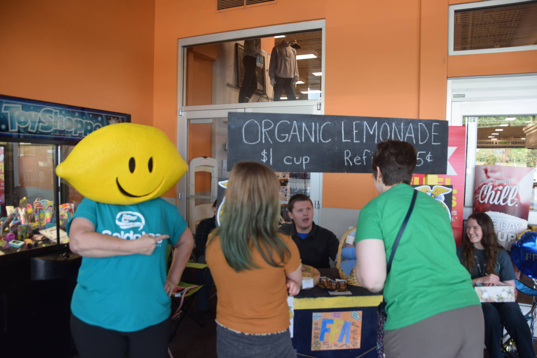 Lemonhead, played by Terri Burdick, supports the kids of the Midnight Sun FFA Chapter at their lemonade stand inside Fred Meyer during Lemonade Day in Soldotna, Alaska on June 29, 2019. (Photo by Brian Mazurek/Peninsula Clarion)