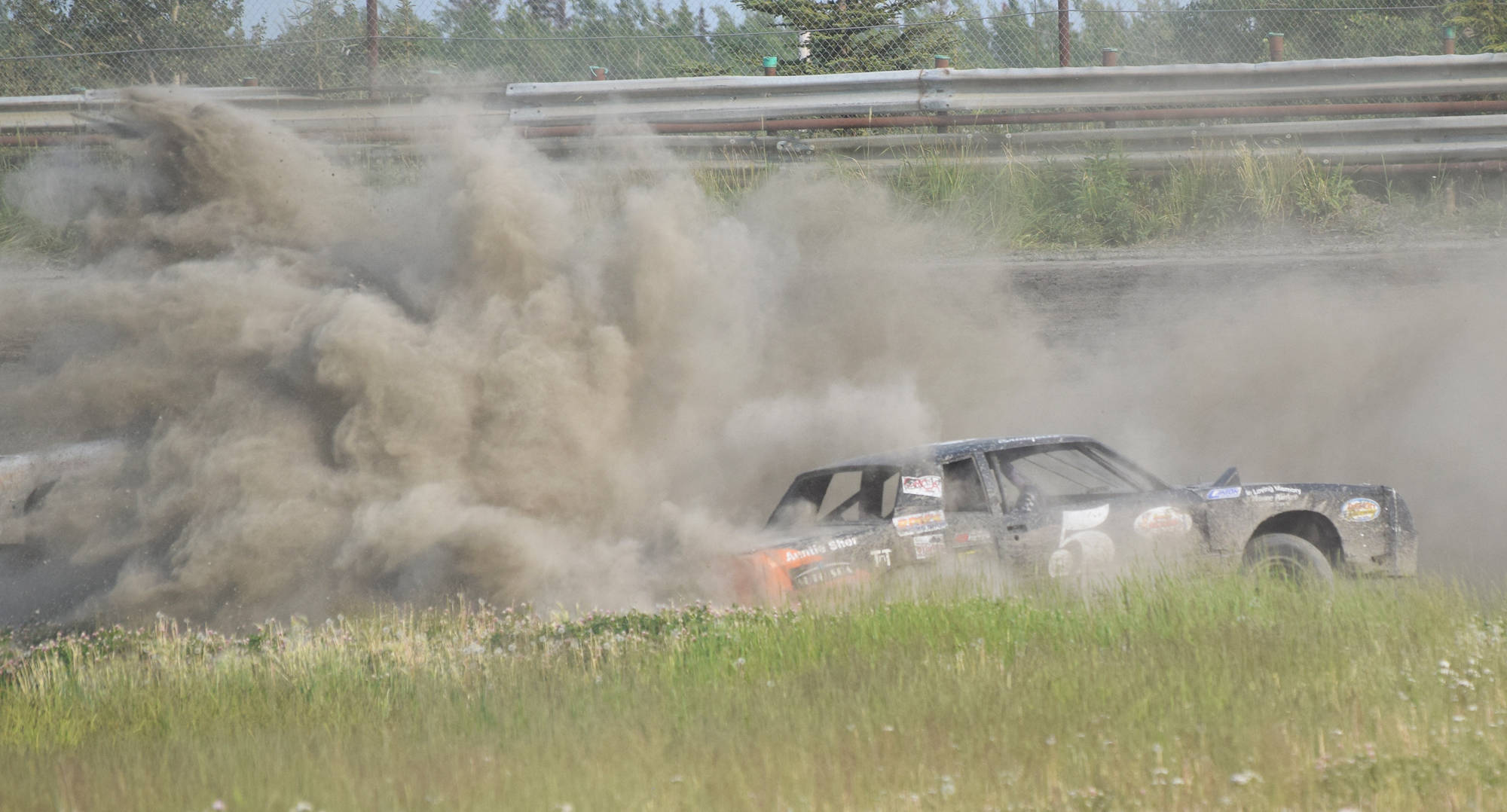 The #5 A-Stock car of Bridgette Attleson spins out in the dirt Saturday, June 29, 2019, at Twin Cities Raceway in Kenai, Alaska. (Photo by Joey Klecka/Peninsula Clarion)